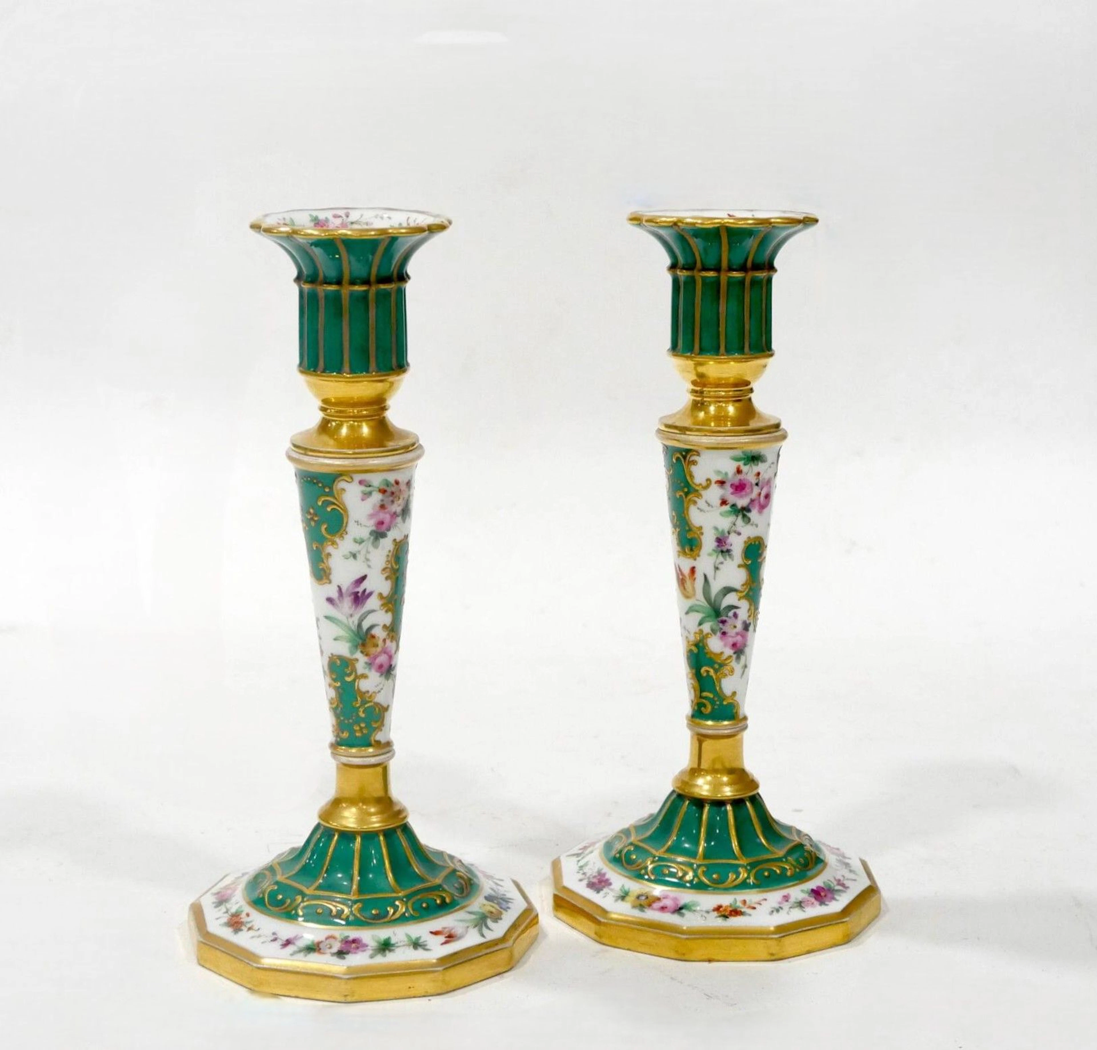 Pair of porcelain candlesticks with a floral design accented - Lot 193
