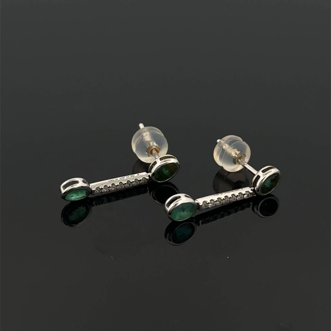 Pair of "Ligne" white gold (750) earrings set with two emera - Lot 313