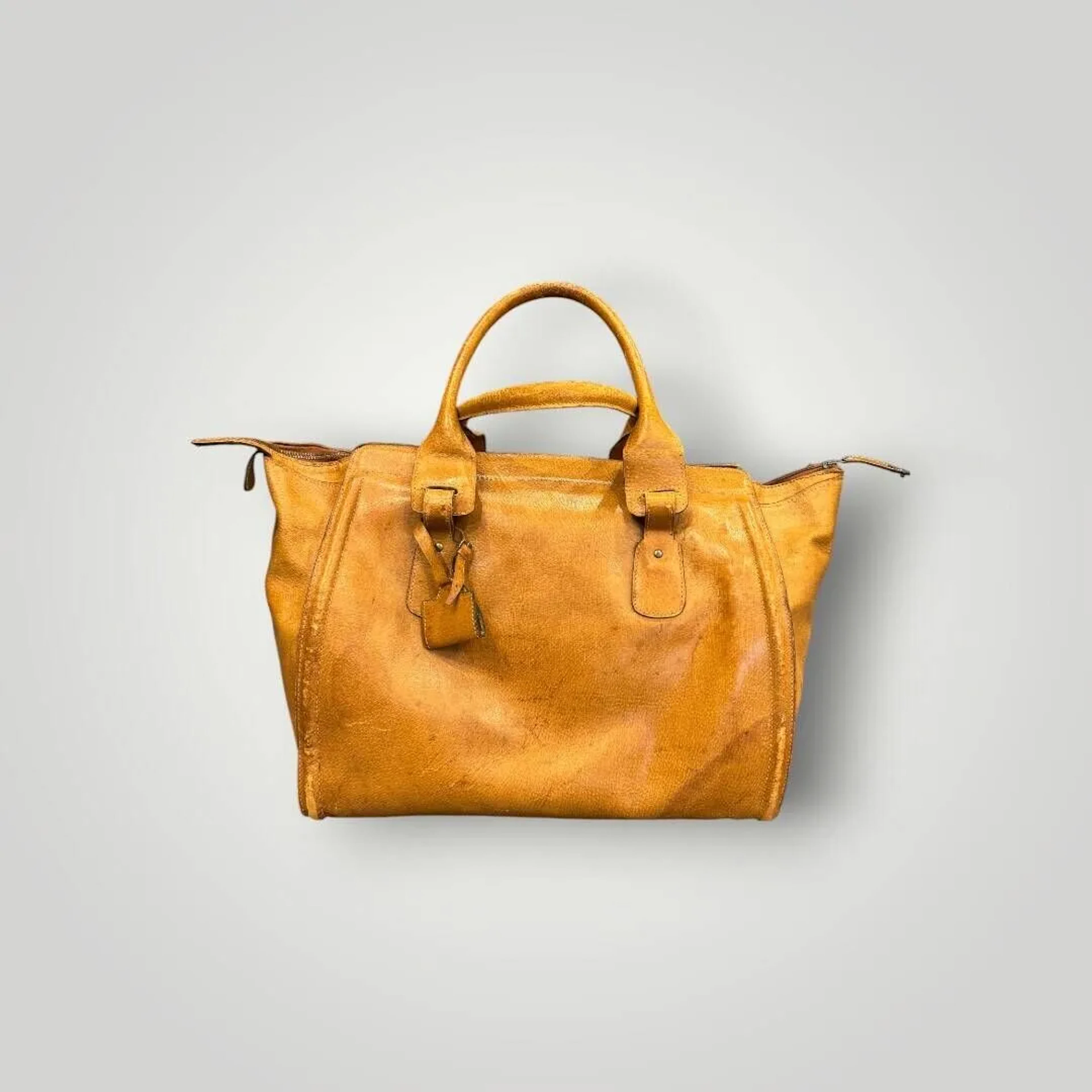 LANCEL Sac de voyage vintage en cuir jaune. Etat d'usage