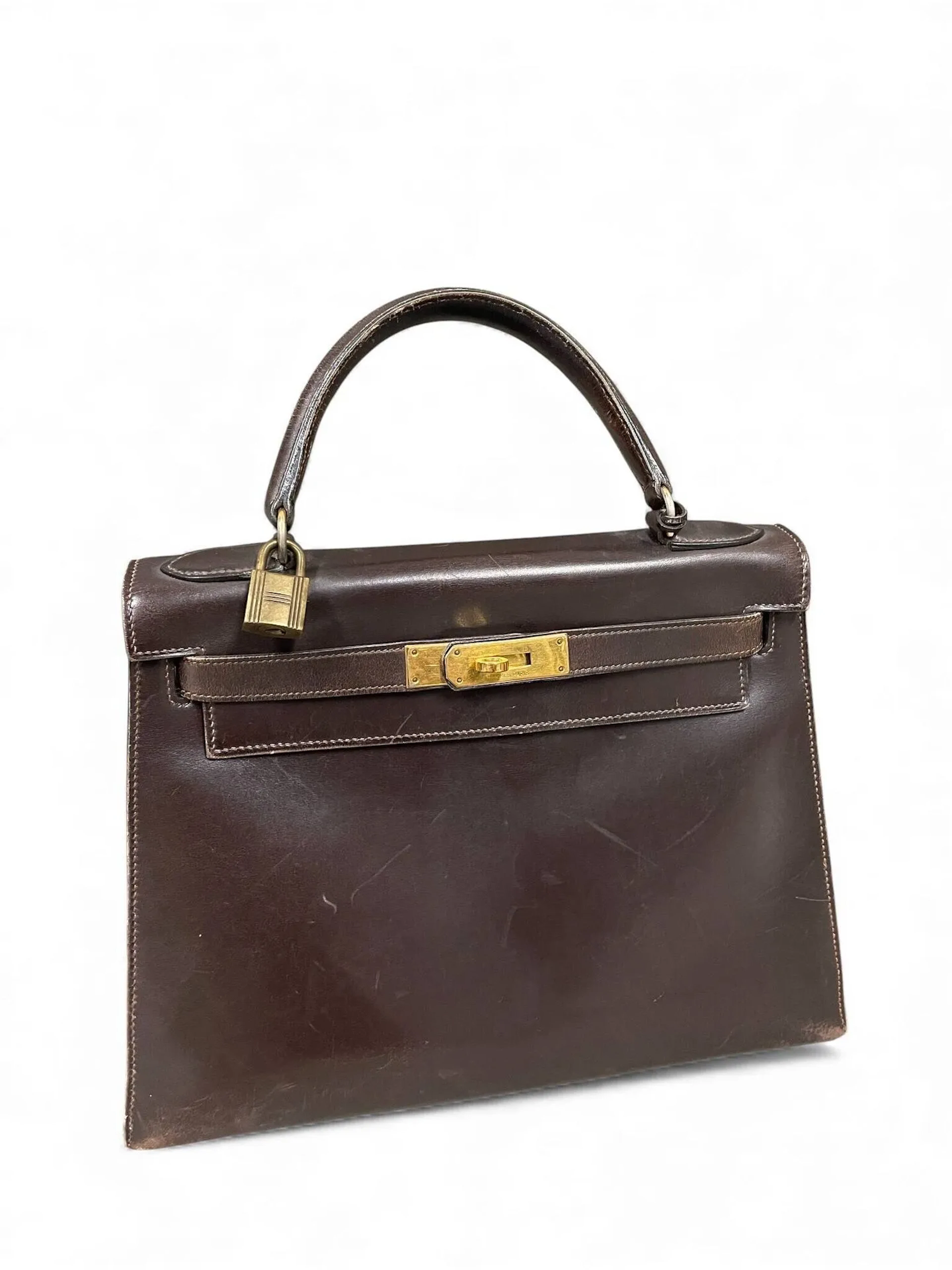 HERMES Kelly bag 28 cm in brown box calfskin. Brown chère li - Lot 180