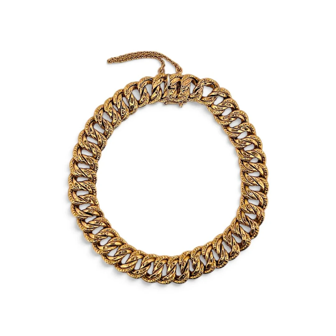 Yellow gold (750) bracelet with partially engraved American- - Lot 196