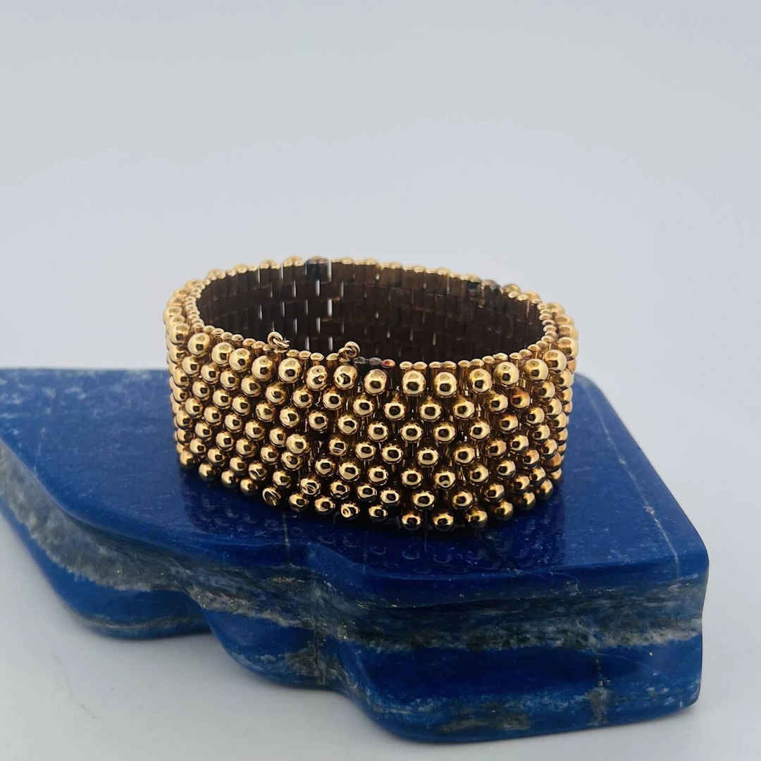 18K (750) yellow gold ribbon bracelet with articulated links - Lot 333