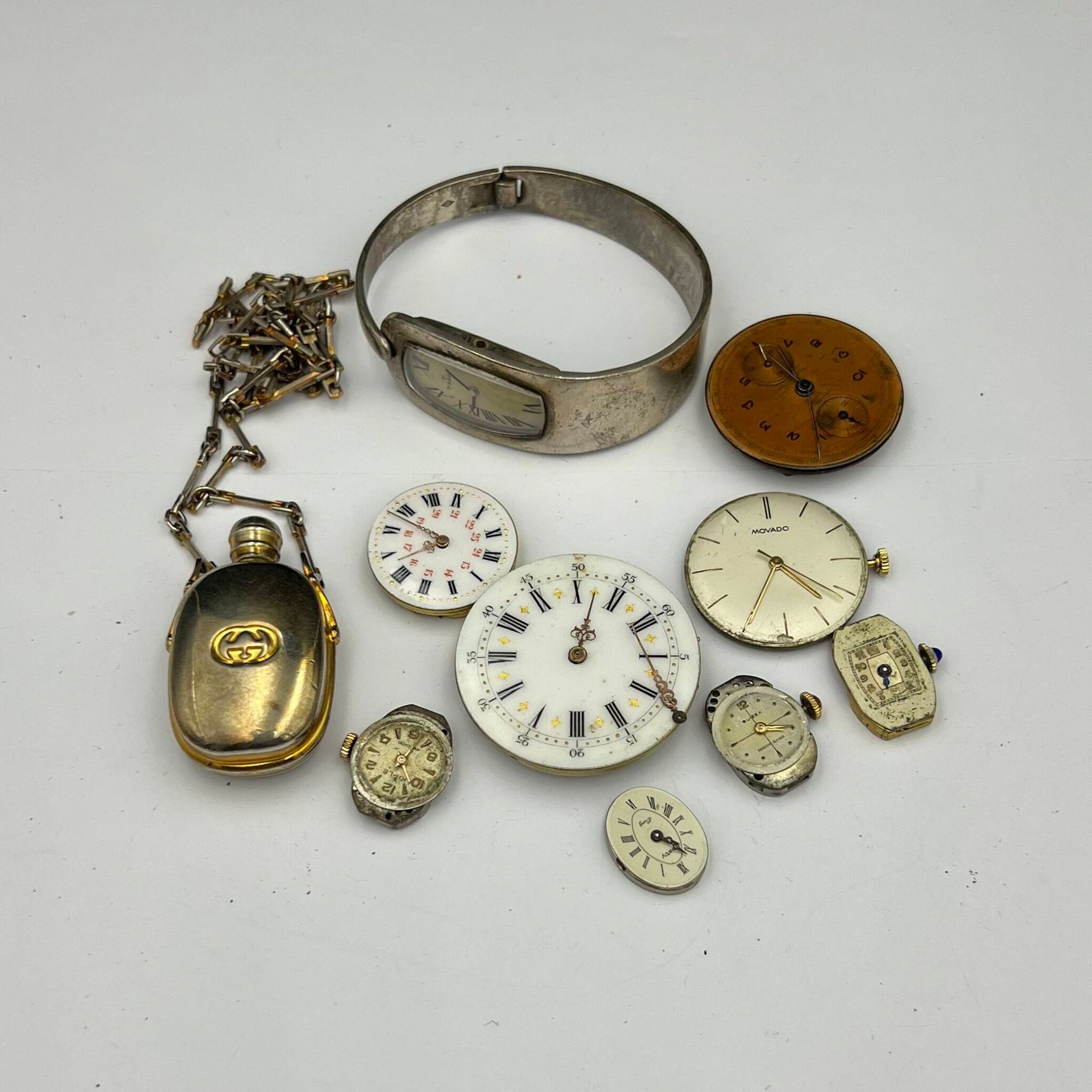 Lot includes: TISSOT silver watch, GUCCI bottle-shaped neckl - Lot 273