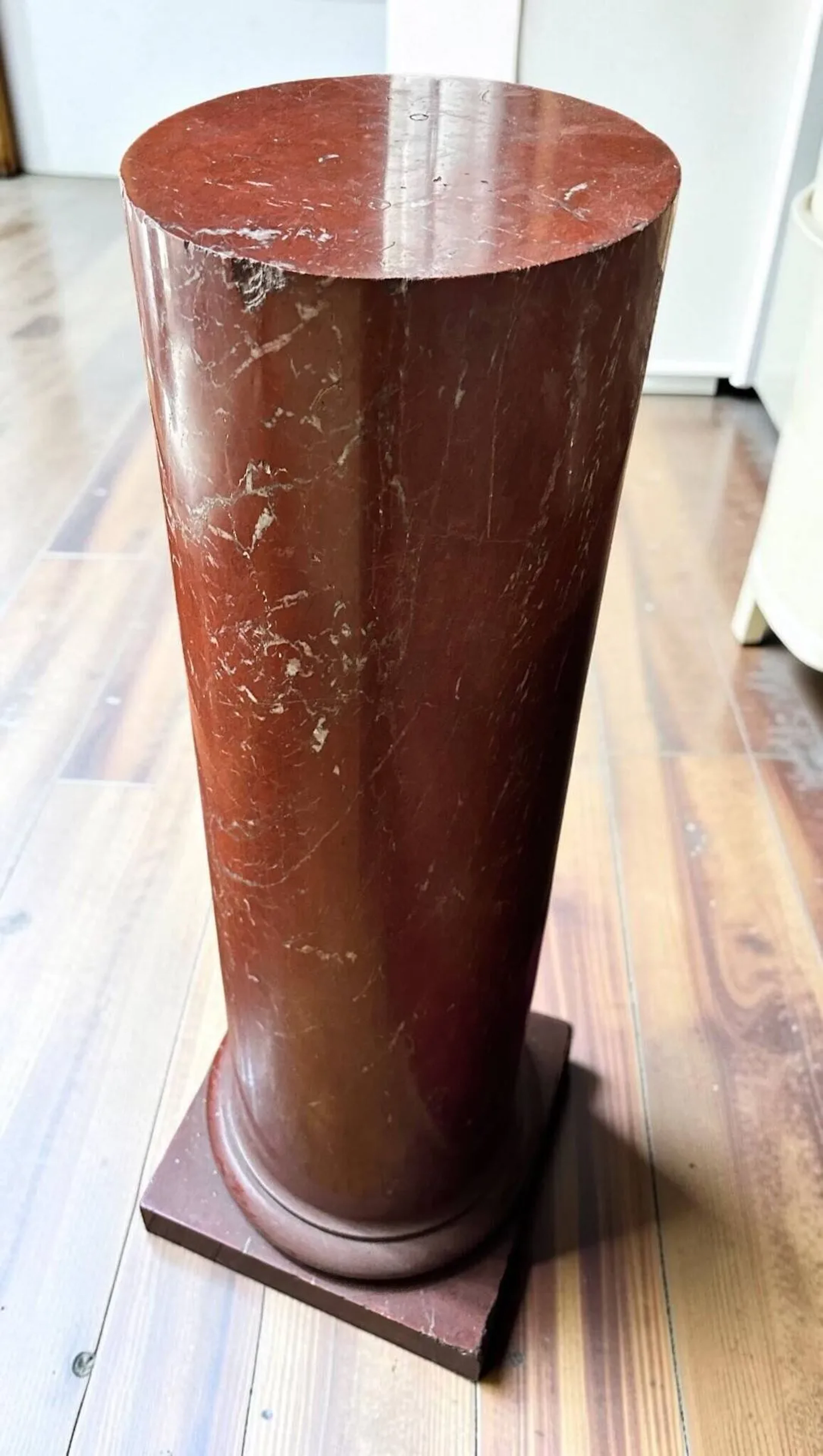 Pair of circular red marble columns resting on a square base - Lot 342