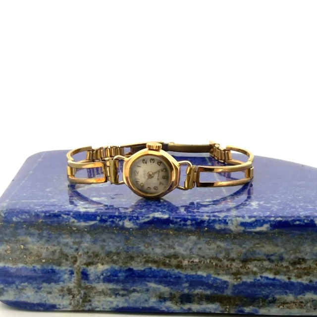 Round ladies' watch in yellow gold (750). Cream-colored dial - Lot 323