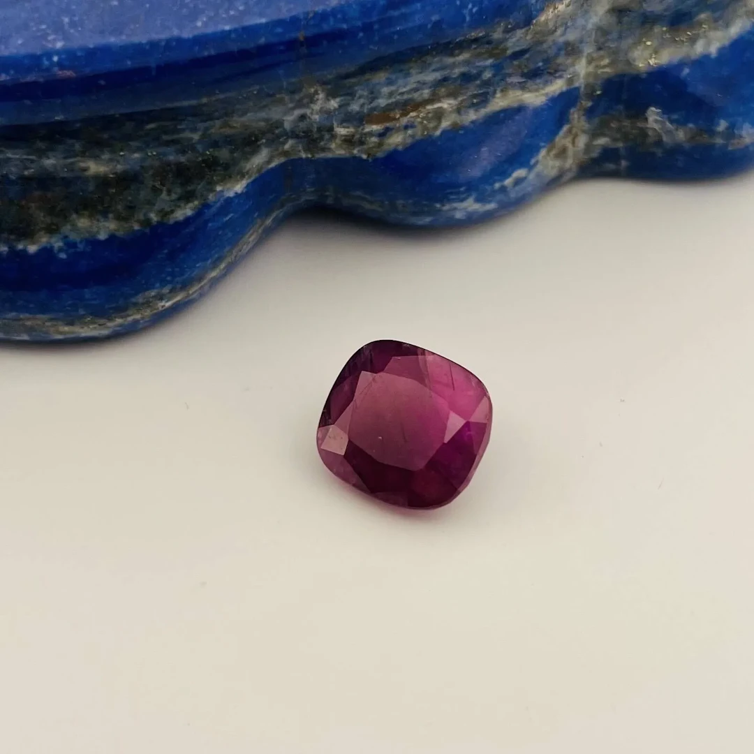 Cushion-cut ruby on paper weighing 13.14 carats. Accompanied - Lot 367