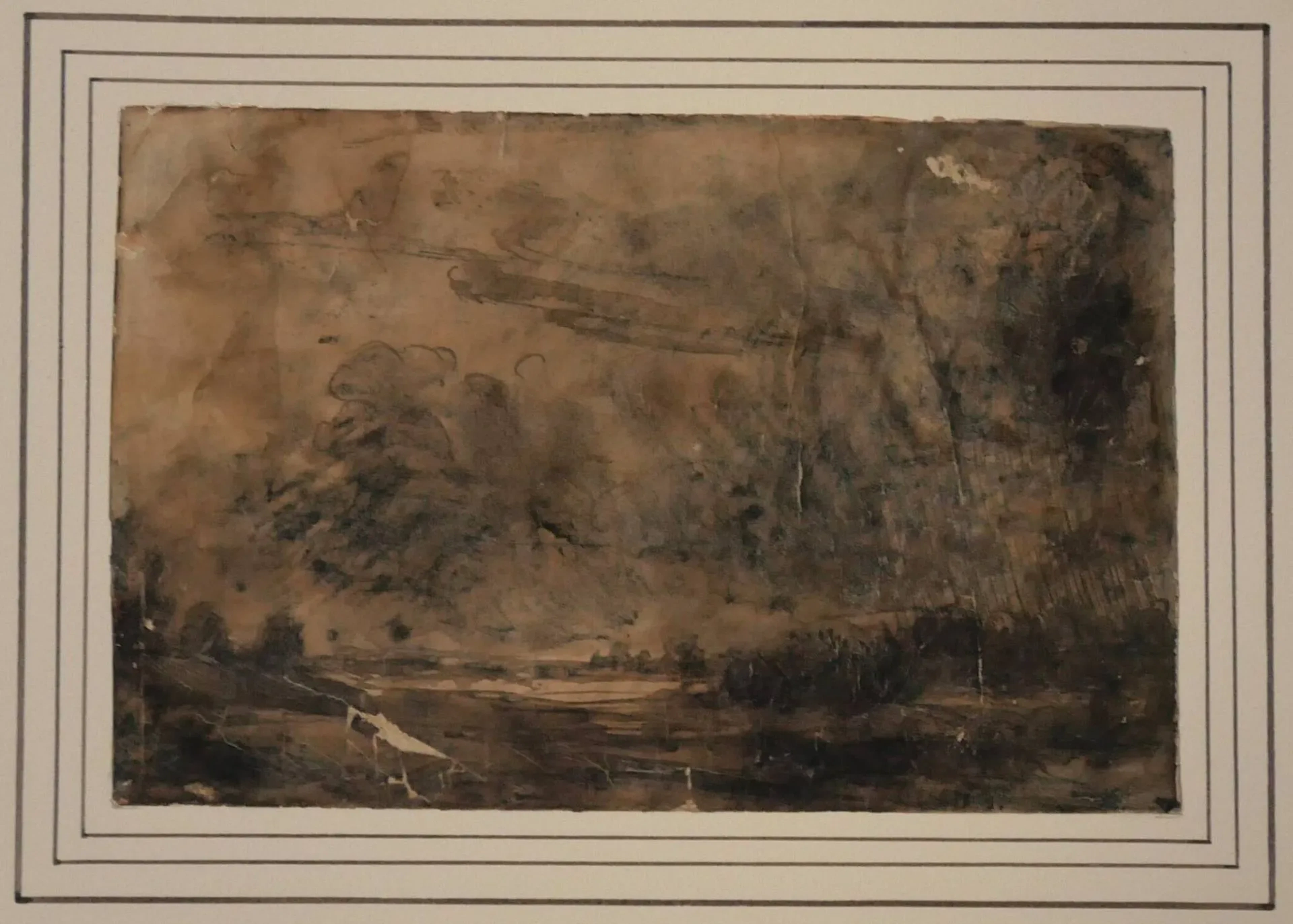 ÉCOLE ROMANTIQUE, dans le goût de François Auguste RAVIER, Plaine sous un orage, Plume et lavis d'encre brune et rehauts de bleu (accidents et manques), non signé, au verso porte le cachet de la collection Paul et Florence Vercier (L.3607), n°12bis, 12,8x19,2 cm.