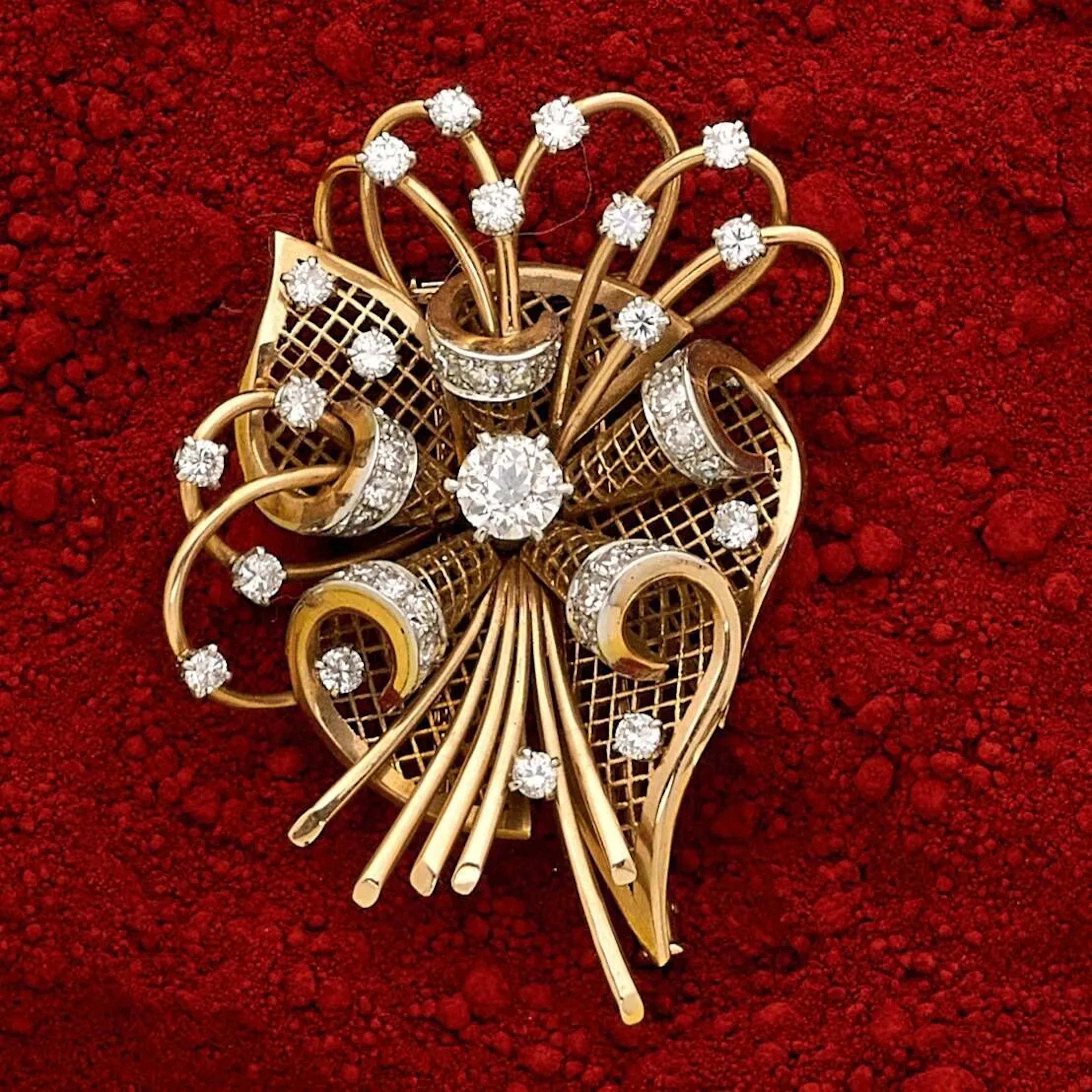 18k (750e) gold and platinum clip brooch, stylizing a wire k - Lot 124