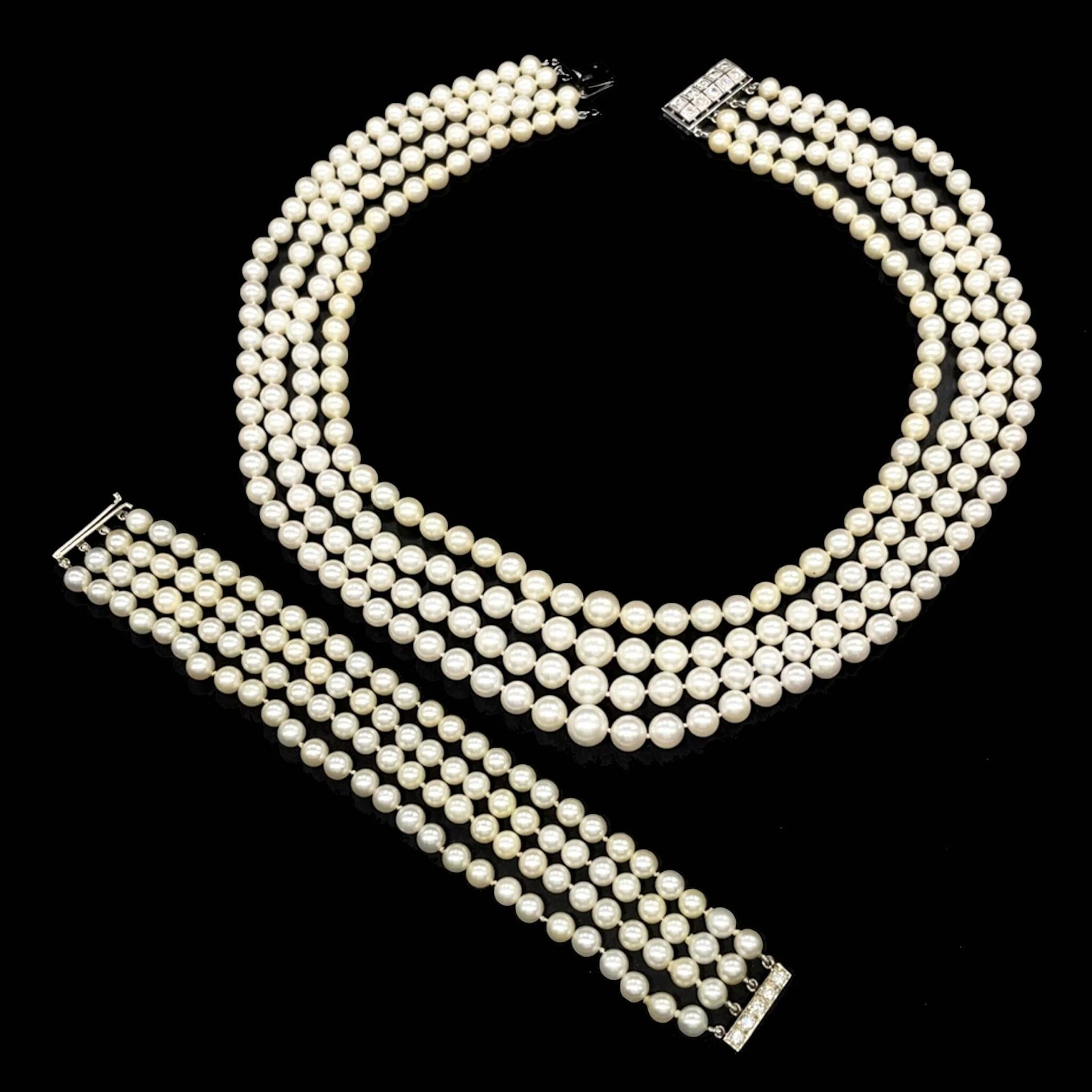 A half-set consisting of four rows of cultured pearls, inclu - Lot 186