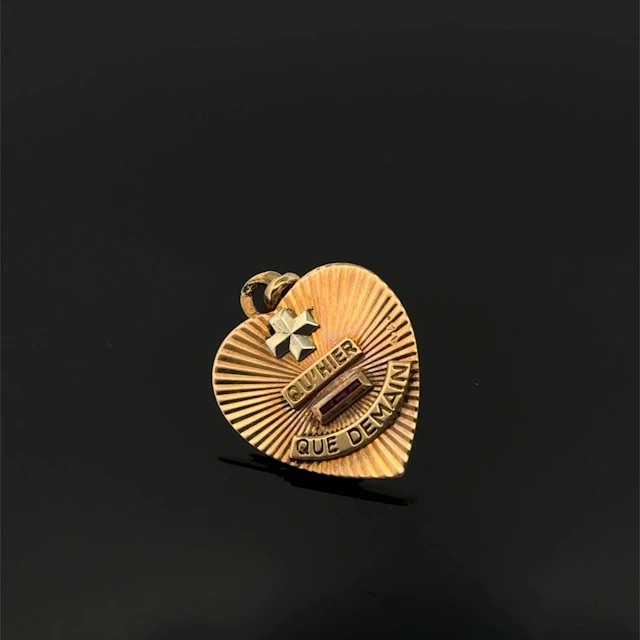 "Heart" pendant inscribed with "+ than yesterday and - than - Lot 301