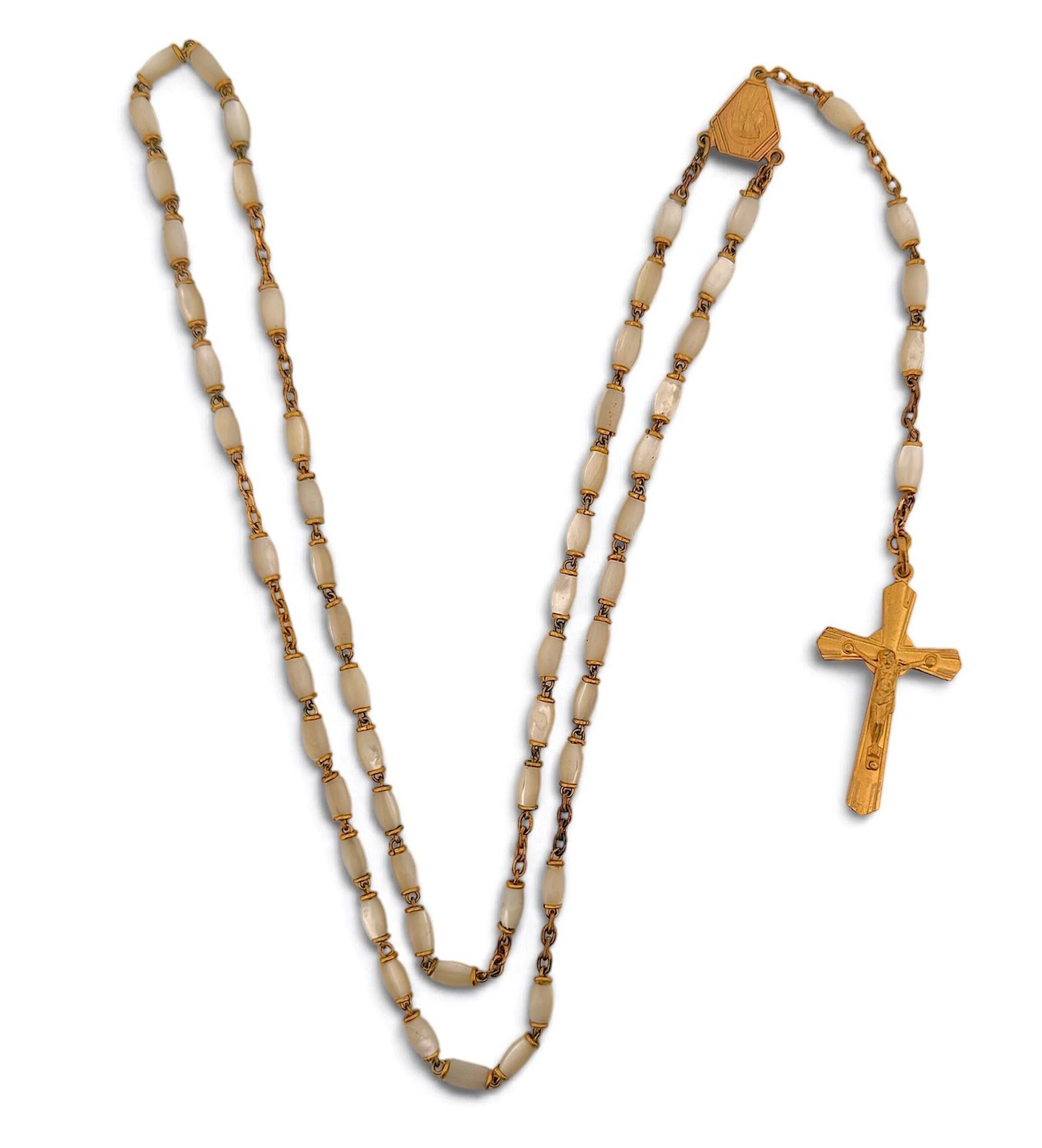 A gold-plated metal rosary with mother-of-pearl beads. - Lot 387