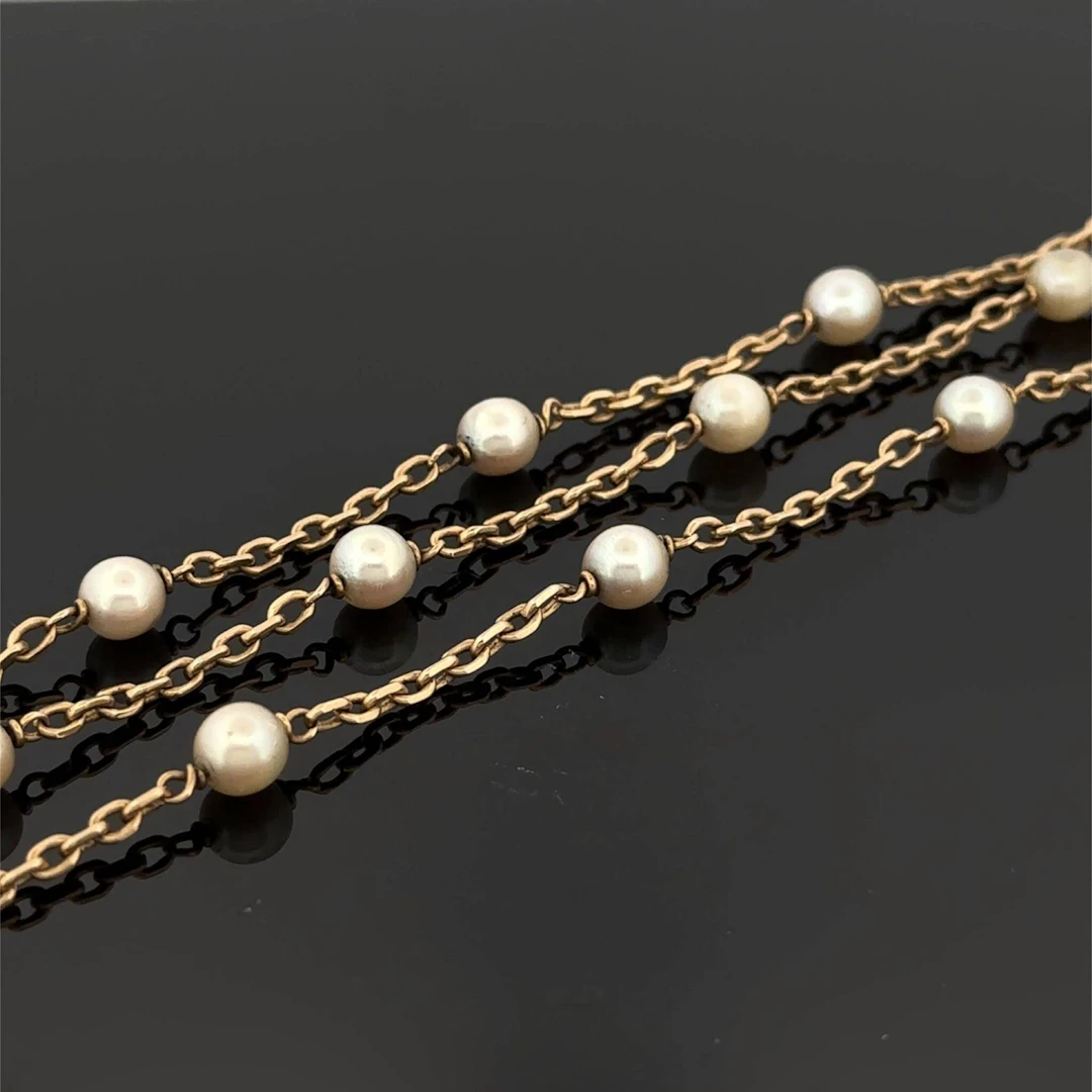 Yellow gold (750) bracelet consisting of three chains holdin - Lot 167