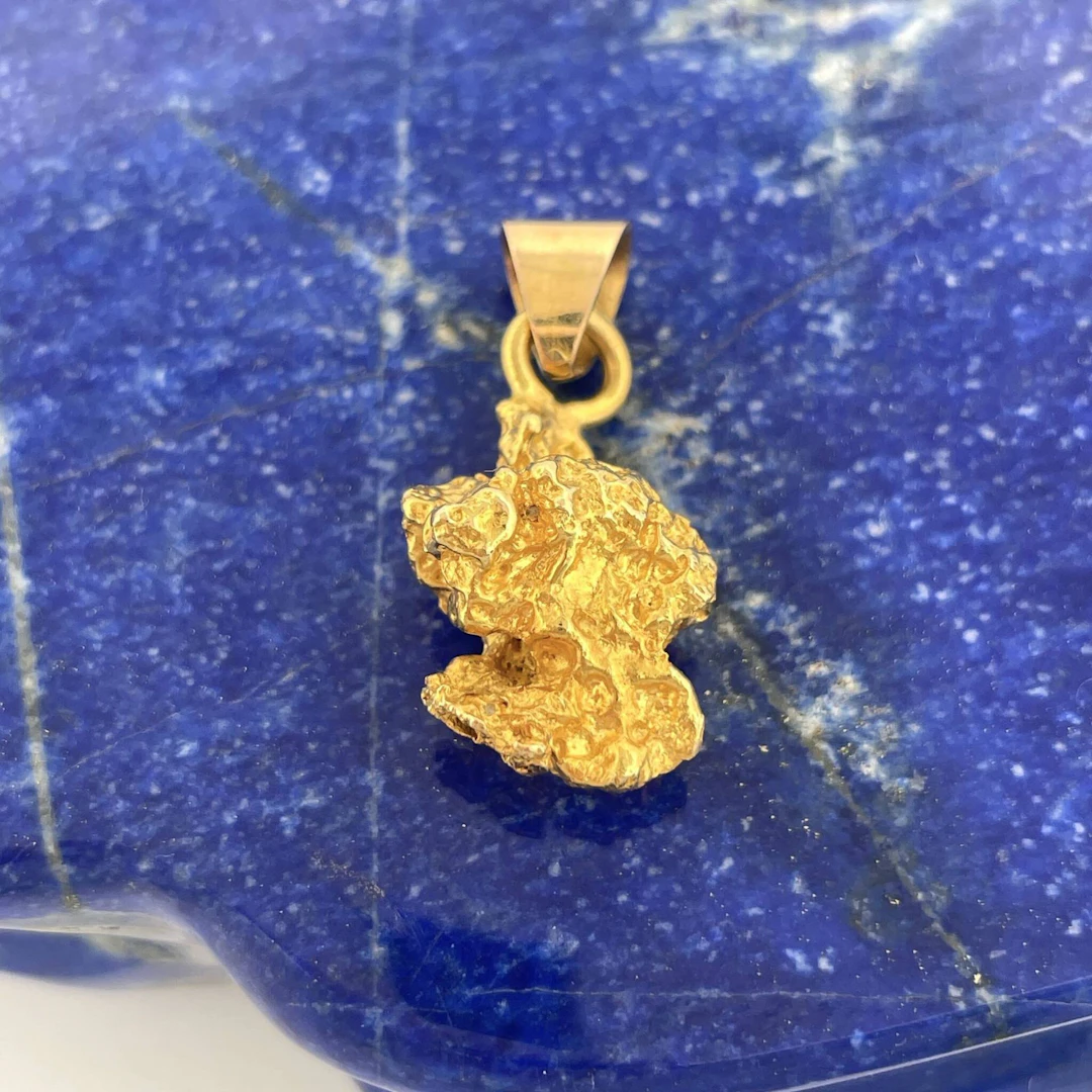 Yellow gold (750) pendant featuring a gold nugget. - Lot 274