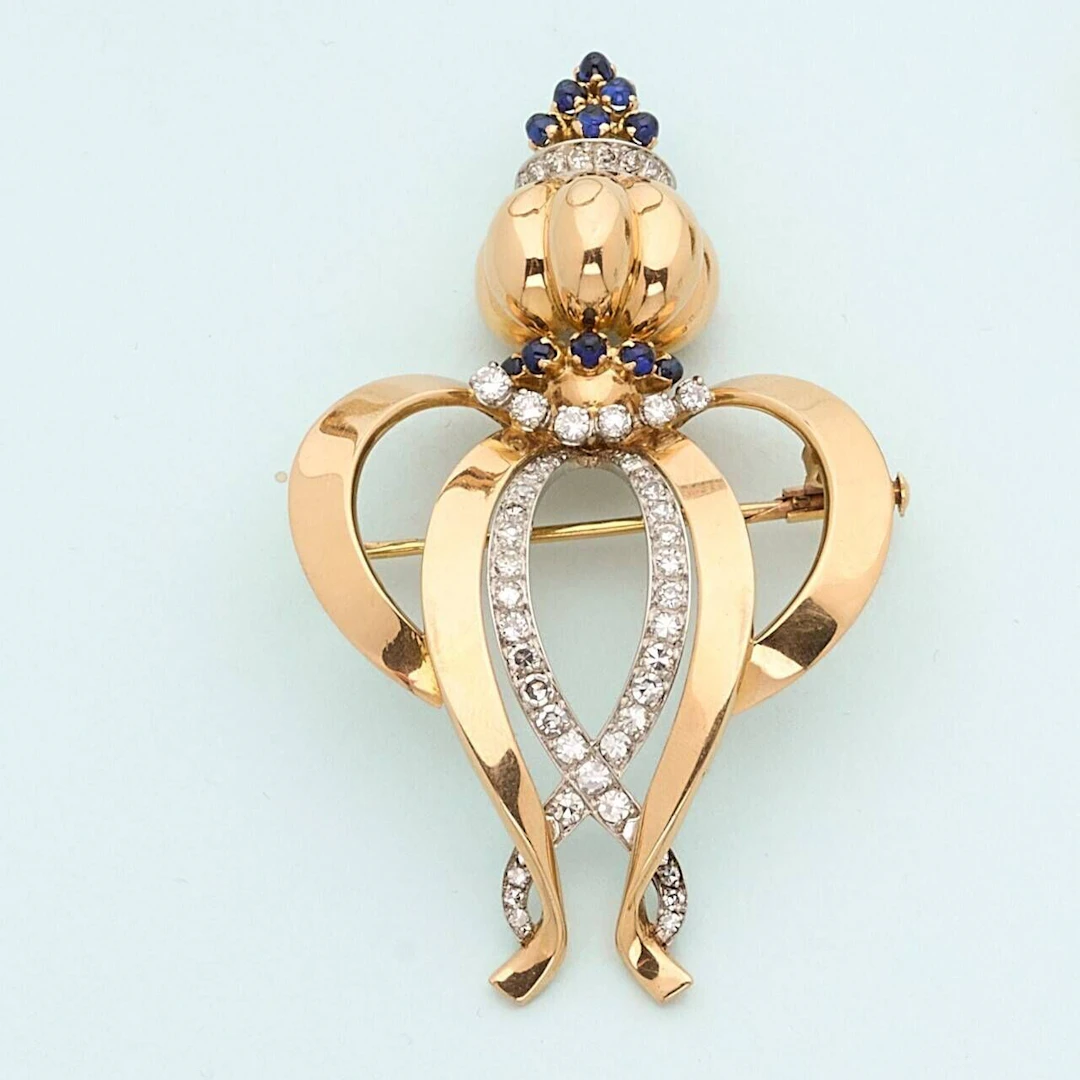 Brooch in 18k gold (750e) and platinum (950e), featuring a d - Lot 232