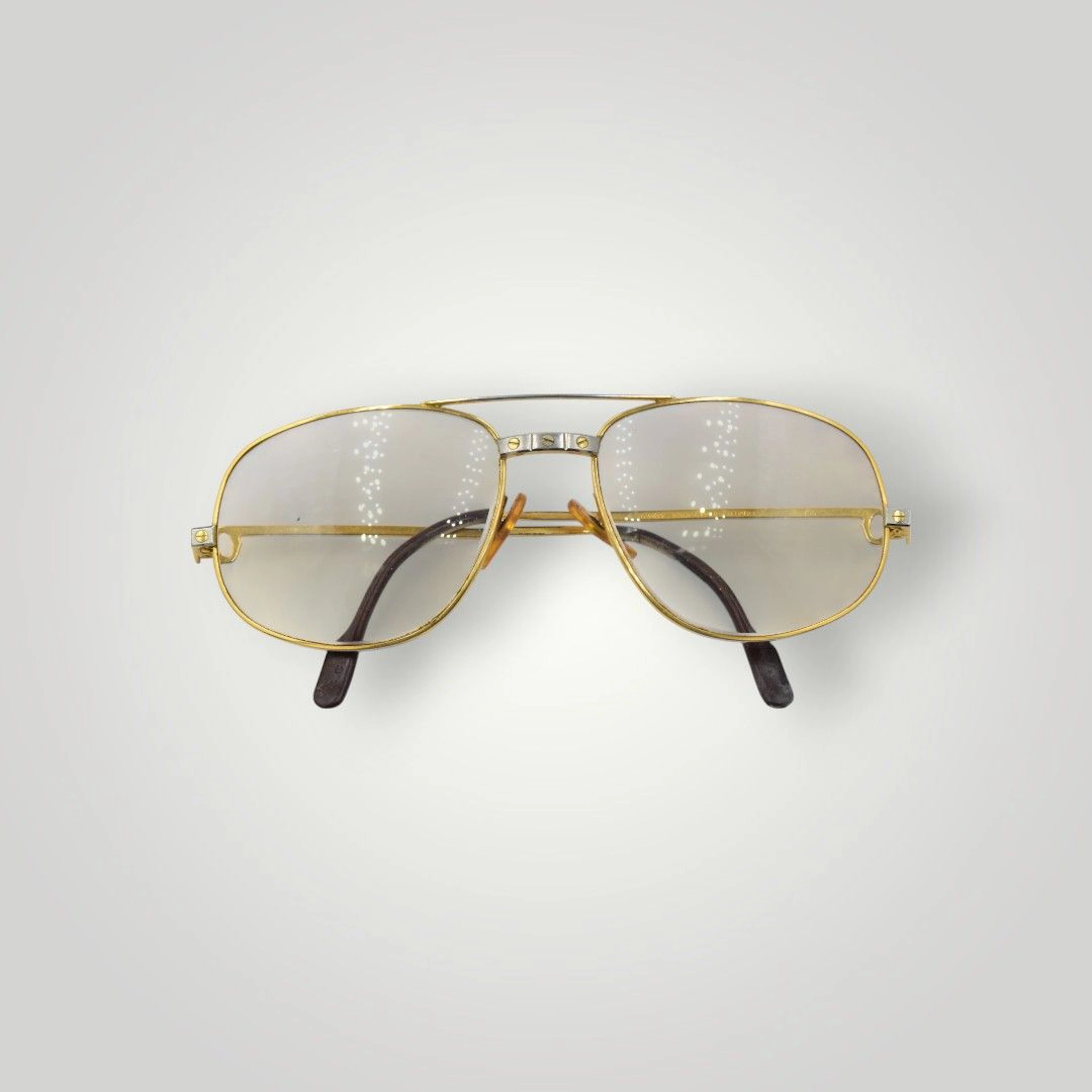 CARTIER Pair of Santos two-bridge eyeglasses In used conditi - Lot 195