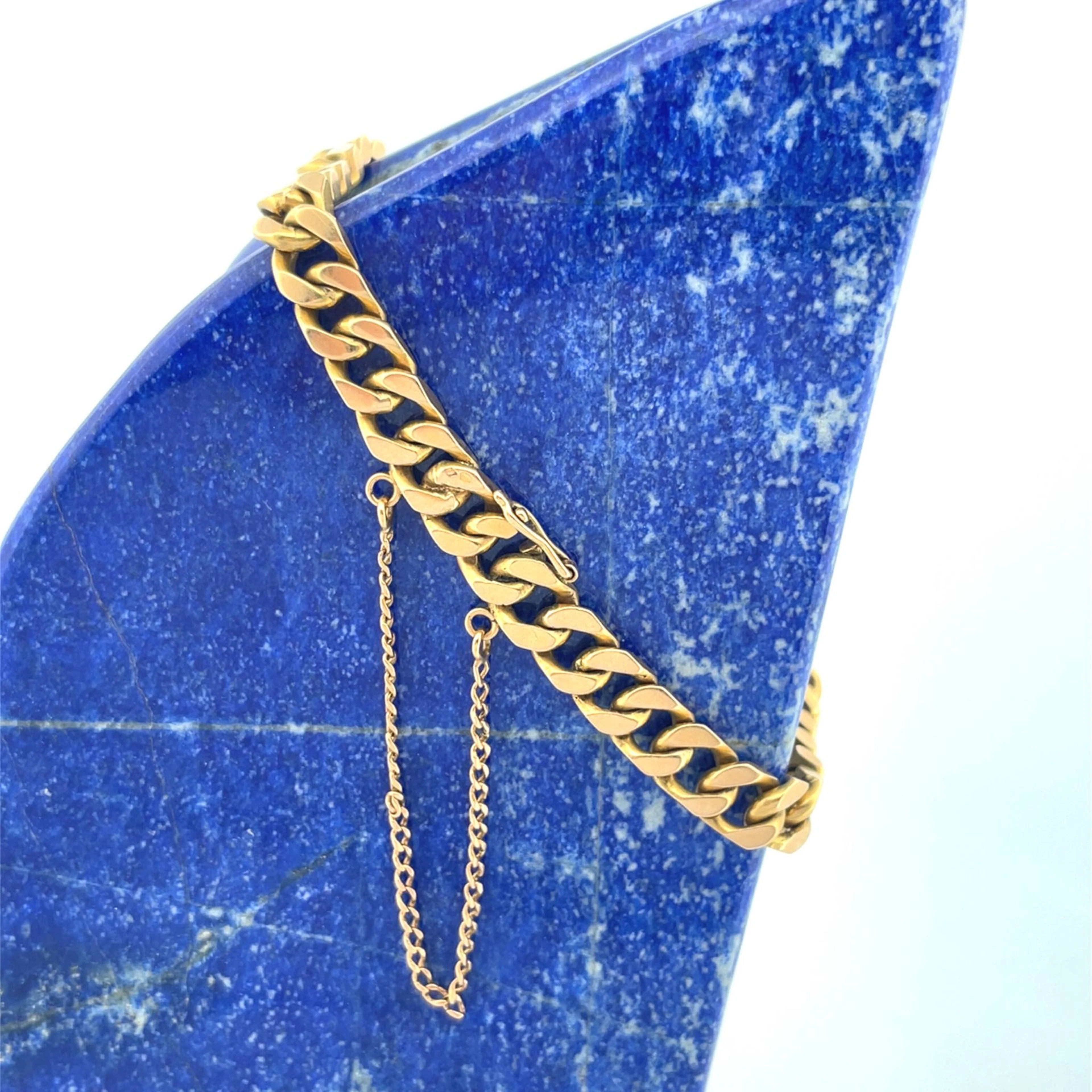 Yellow gold (750) bracelet with a filed curb chain and safet - Lot 128