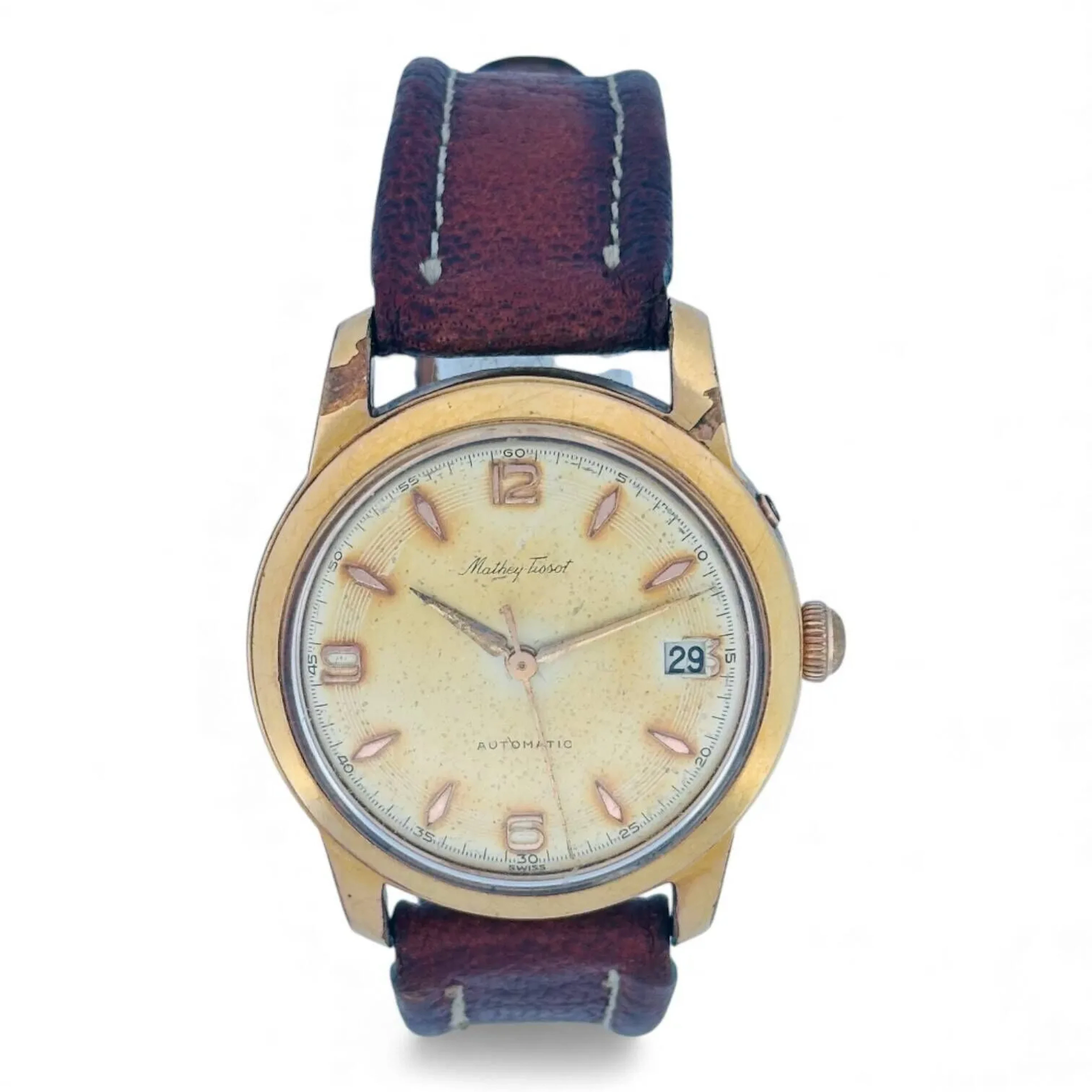 MATHEY-TISSOT Montre-bracelet en métal plaqué or et acier, cadran argenté/doré, index en appliques dorées, aiguilles alpha dorées, date à trois heures. Fond en acier vissé. Mouvement mécanique à remontage automatique signé Mathey-Tissot, base AS. Bracelet en cuir, boucle ardillon en métal. Montre fonctionnelle lors de l’expertise, sans garantie de fonctionnement futur et d’état des pièces. Rayures au boitier, manques importants de placage. Diamètre 34 mm Vers 1970