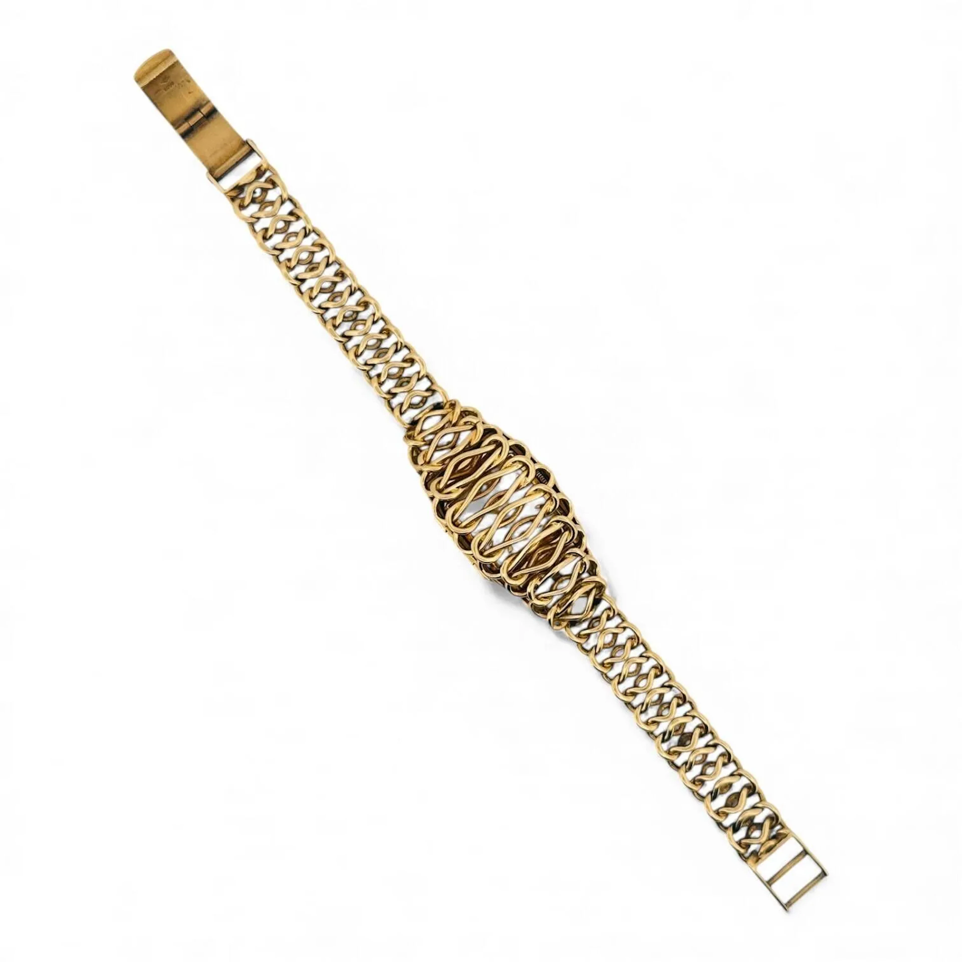 ROLEX Montre bracelet de dame à secret de forme en or 18K (750 millièmes), cadran opalin, index en appliques dorées, aiguilles feuilles dorées. Le boitier dévoilé par un capot de fils d’or 18K (750 millièmes), boitier monté sur charnière et amovible. Couronne signée Rolex. Fond clipé en or 18K (750 millièmes) signé Rolex, référence 1003, à l’intérieur signé Rolex, référence 2161, fabrication Marcel Guyot (clé de Genève 28). Mouvement mécanique à remontage manuel signé Rolex. Bracelet en or 18K (750 millièmes), fermeture à échelle. Montre fonctionnelle lors de l’expertise, sans garantie de fonctionnement futur et d’état des pièces. Rayures au boitier et au verre, quelques légères traces au cadran. Le boitier principal de la montre est de fabrication suisse, et il a été adapté (et donc modifié) dans un boitier plus large avec construction d’une charnière, qui est un travail français. Vers 1950 Poids brut 48,9 g Largeur 20 mm