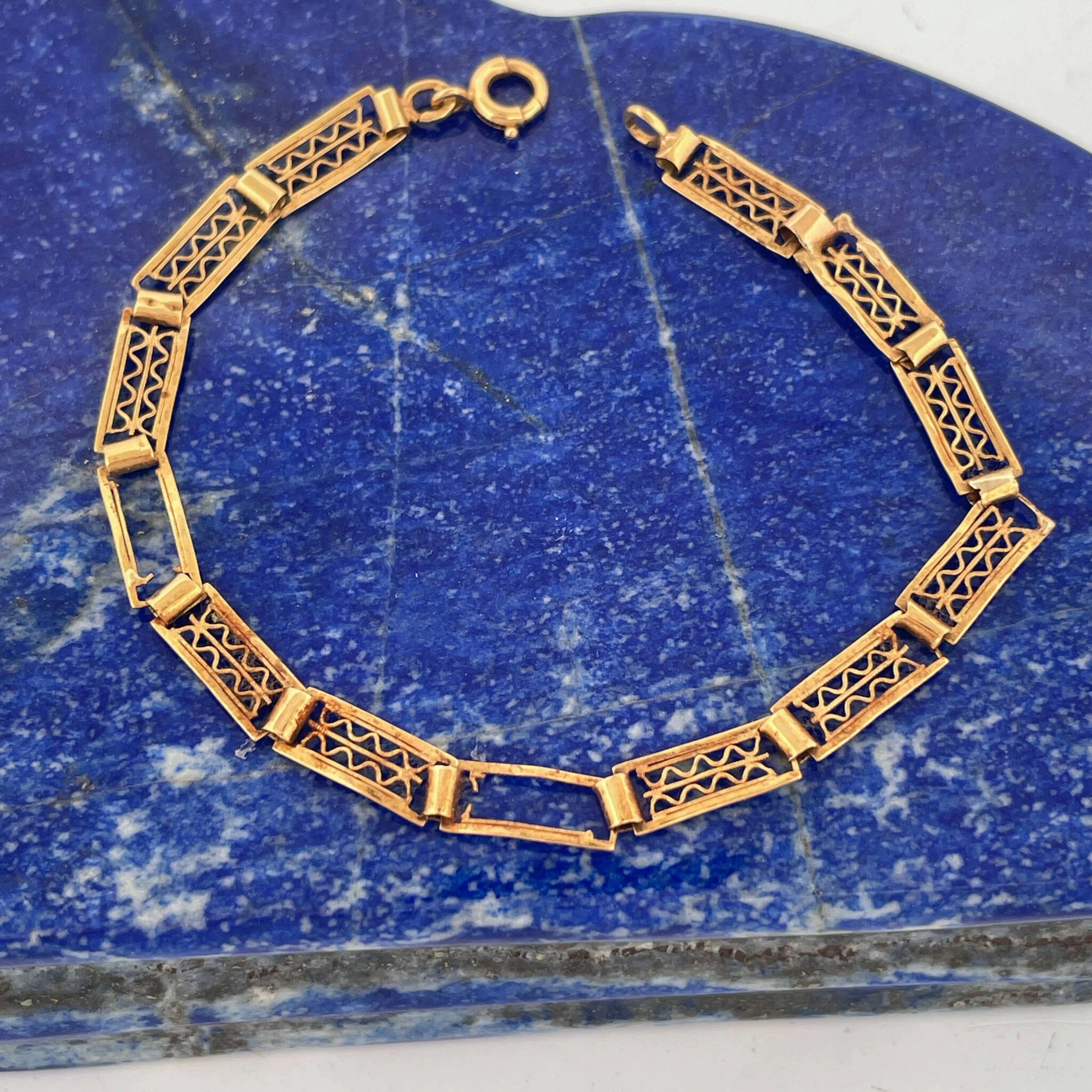 Openwork, hinged yellow gold (750) bracelet with numerous im - Lot 72