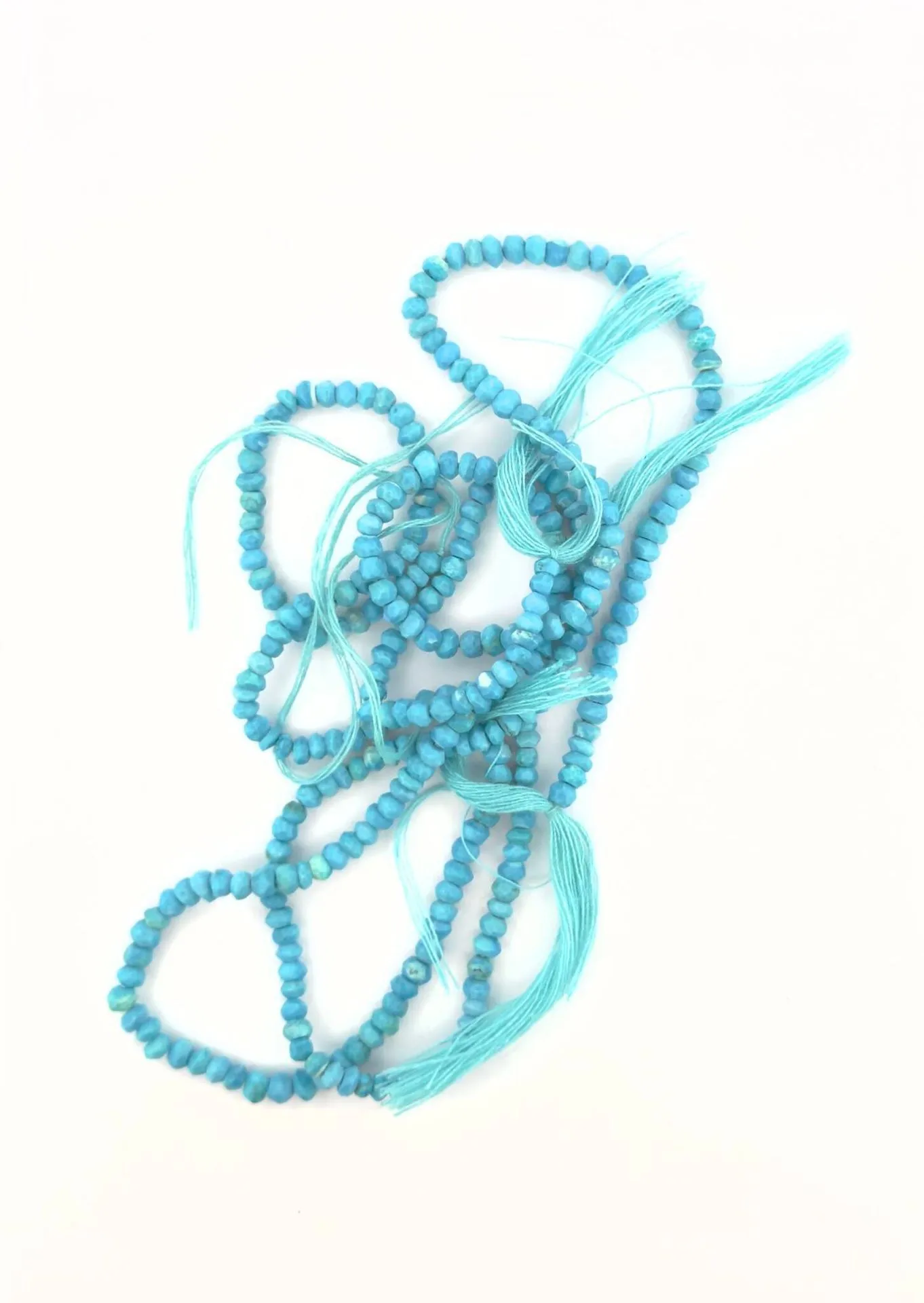 Two strands of irregular faceted turquoise beads. Weight: 50 - Lot 80