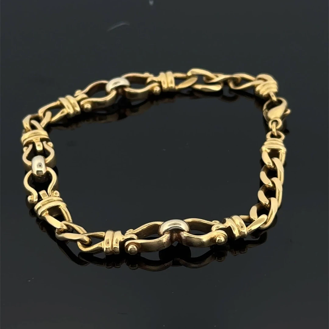 Yellow gold (750) bracelet with a curb chain alternating bet - Lot 197