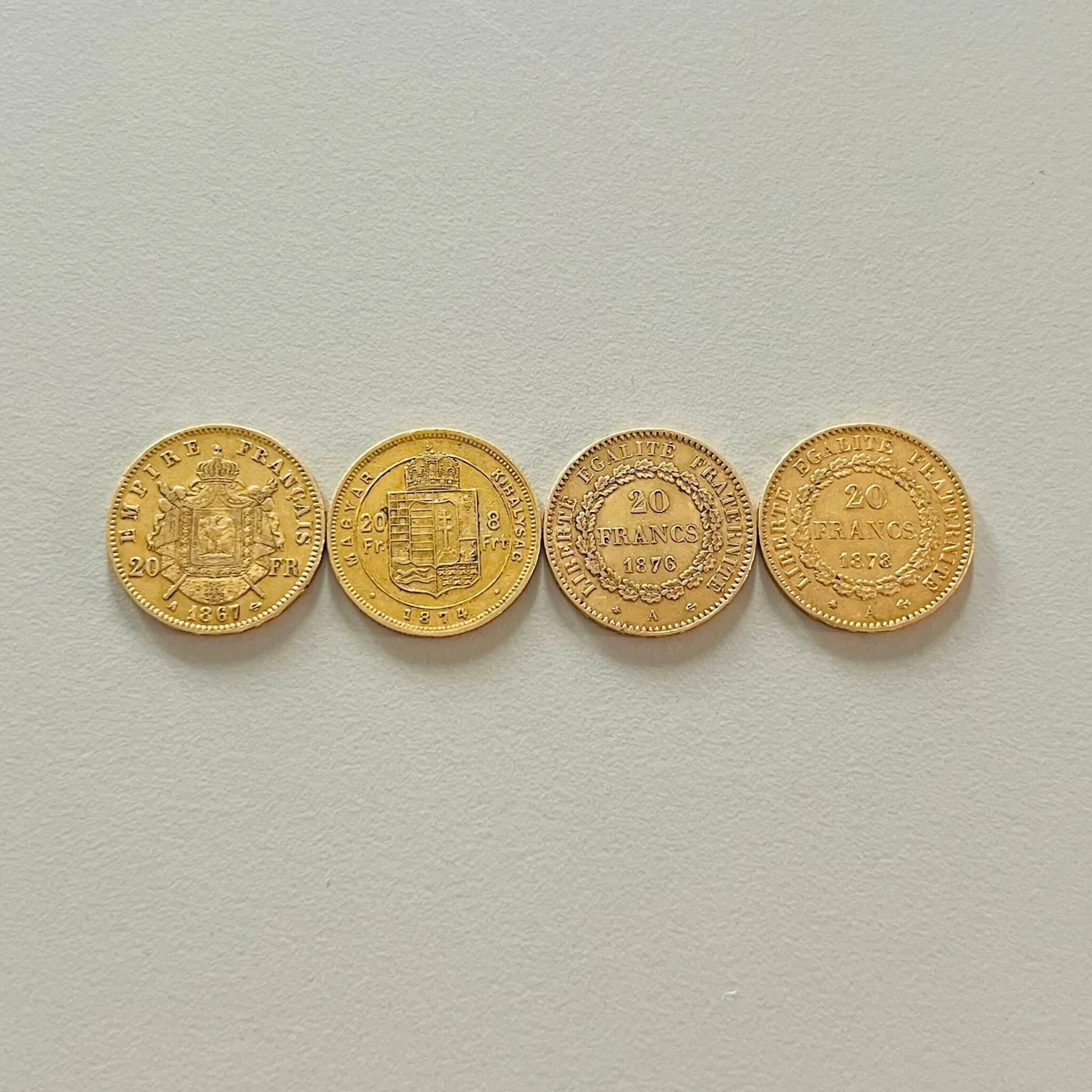 Four gold coins (900) comprising: - Lot 21