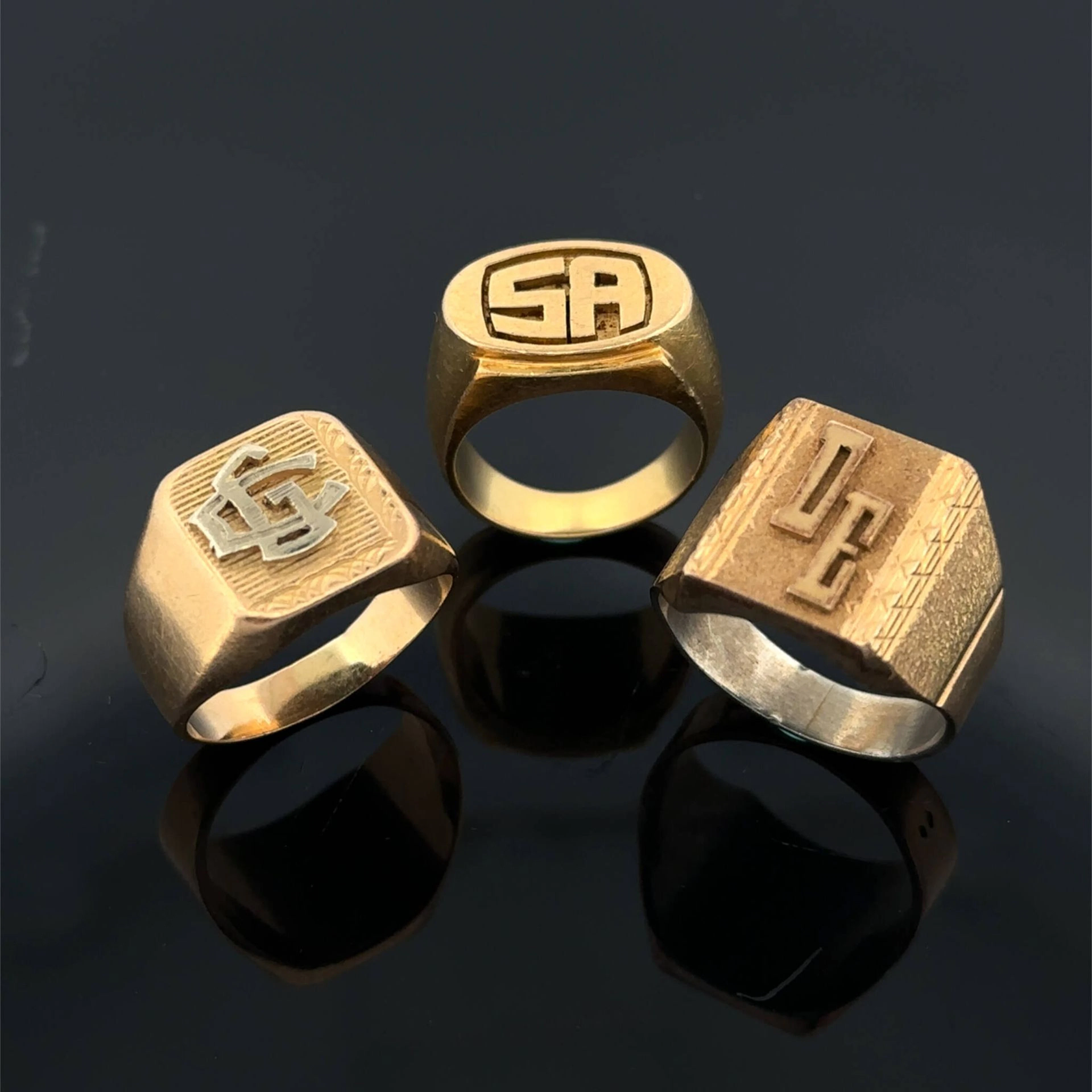 Three monogrammed and engraved signet rings, including: - tw - Lot 150