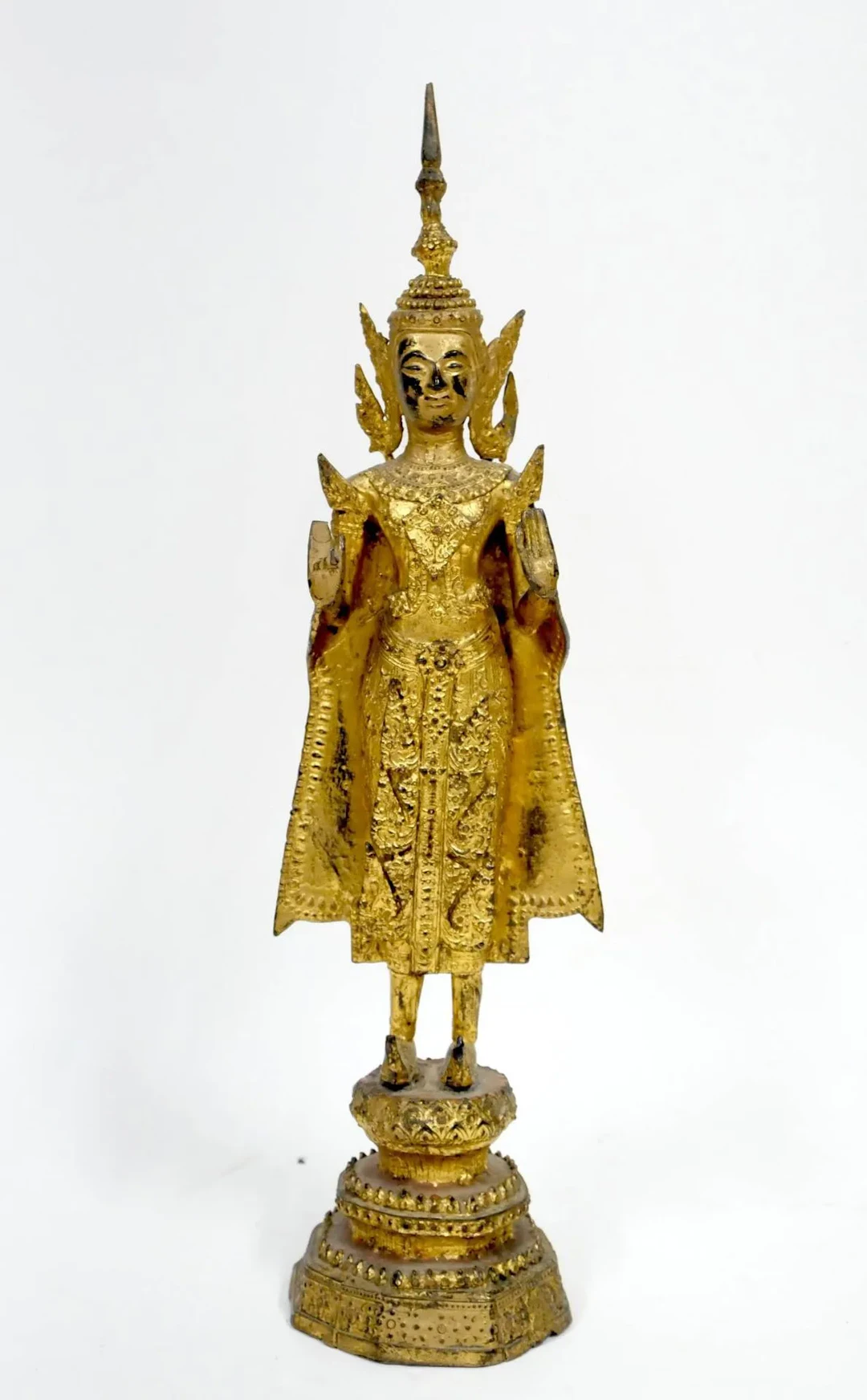 Gilded bronze Buddha in monastic robes, standing with hands - Lot 213