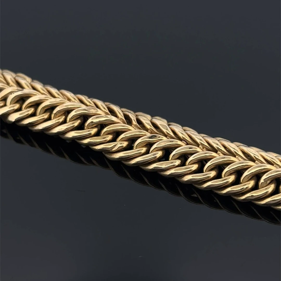 Yellow gold (750) bracelet with a witch's link design. - Lot 228