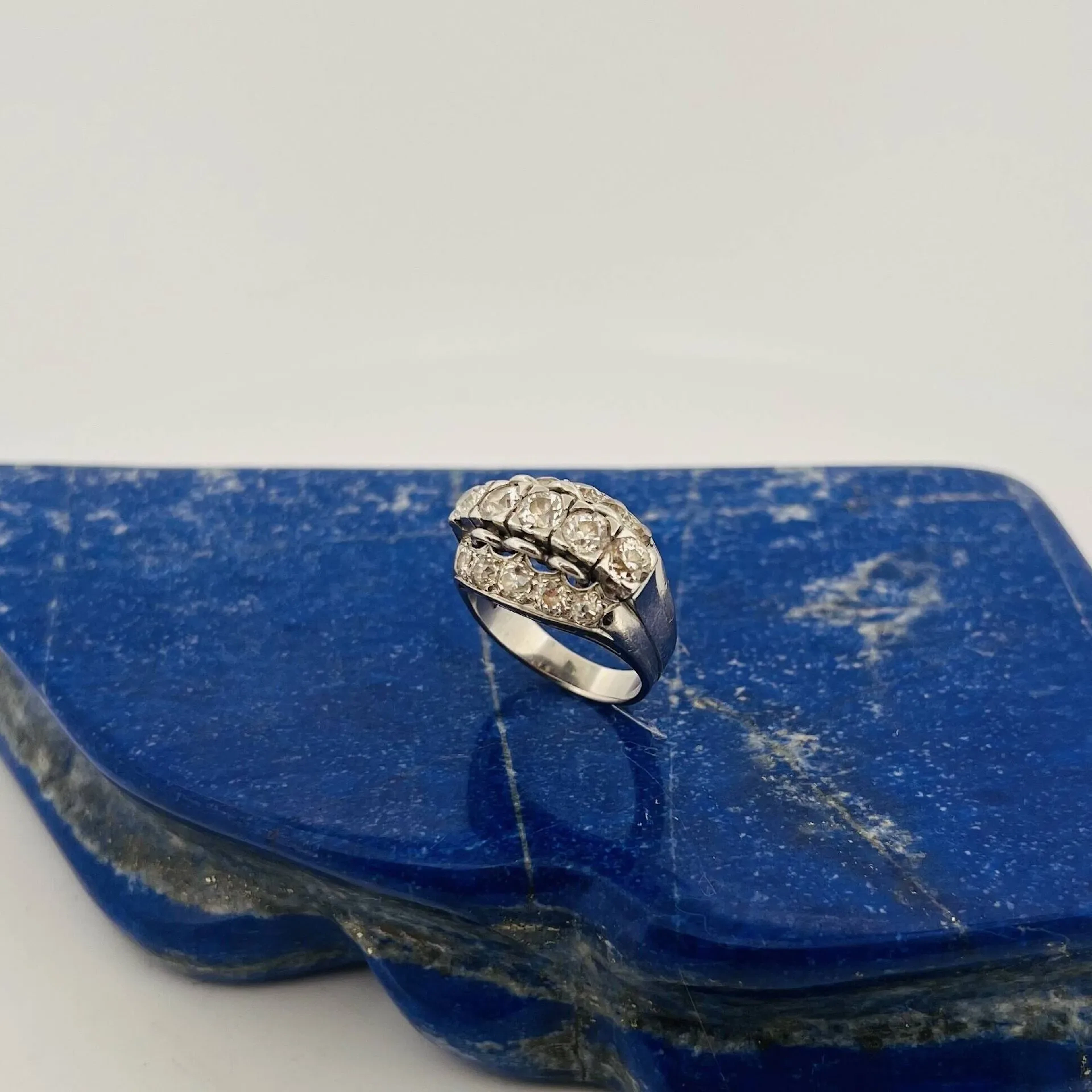 Openwork platinum (950) “bridge” ring, set with three rows o - Lot 237