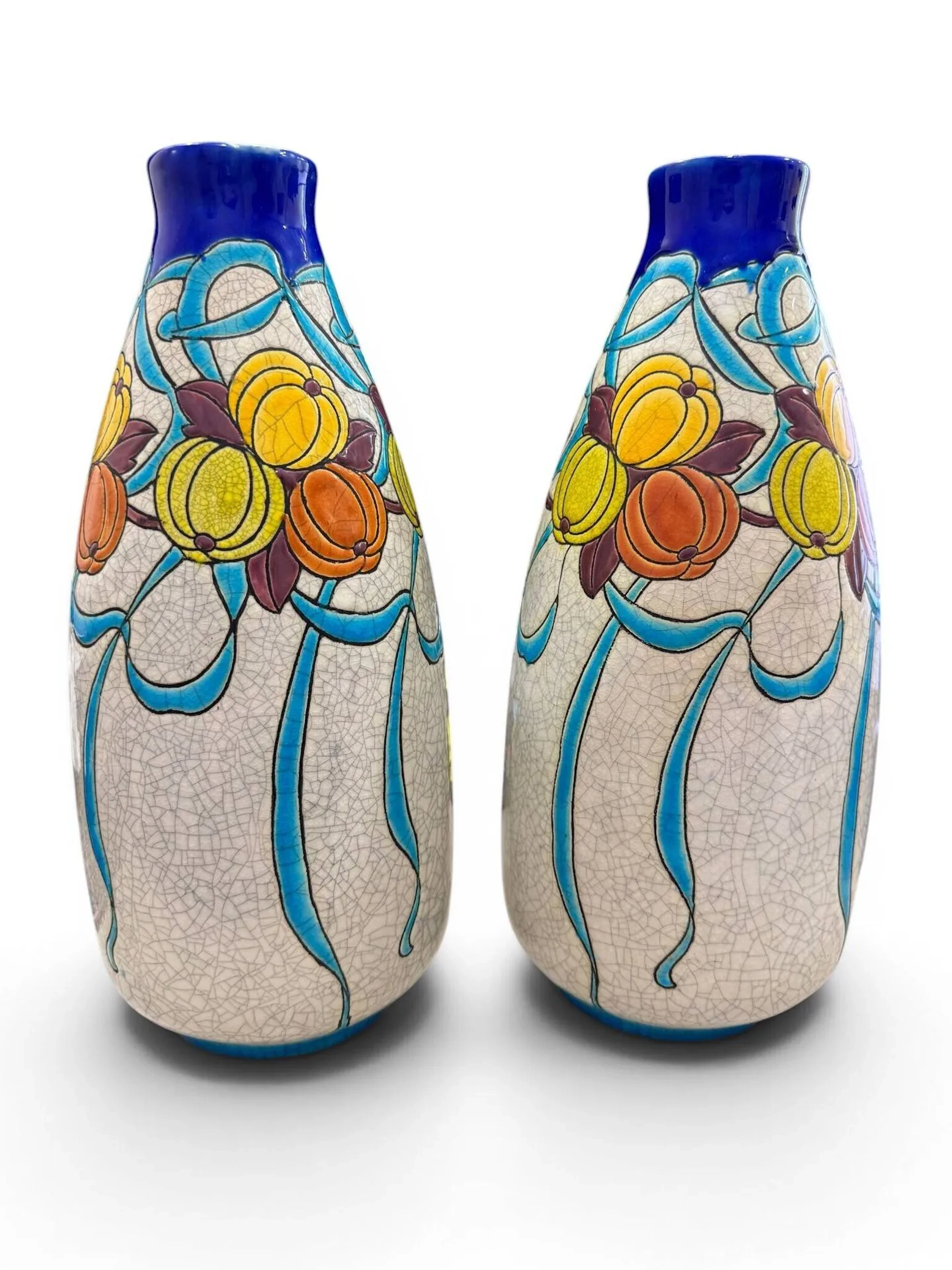 CHARLES CATTEAU (1880-1966) pour KERAMIS - BOCH Frères à LA LOUVIERE Paire de vases ovoïdes en faïence émaillée polychrome à décor de coloquinte dans des motifs rubanés sur fond craquelé, D745, F898 marques sur le dessous Ht. : 31.5 cm chaque