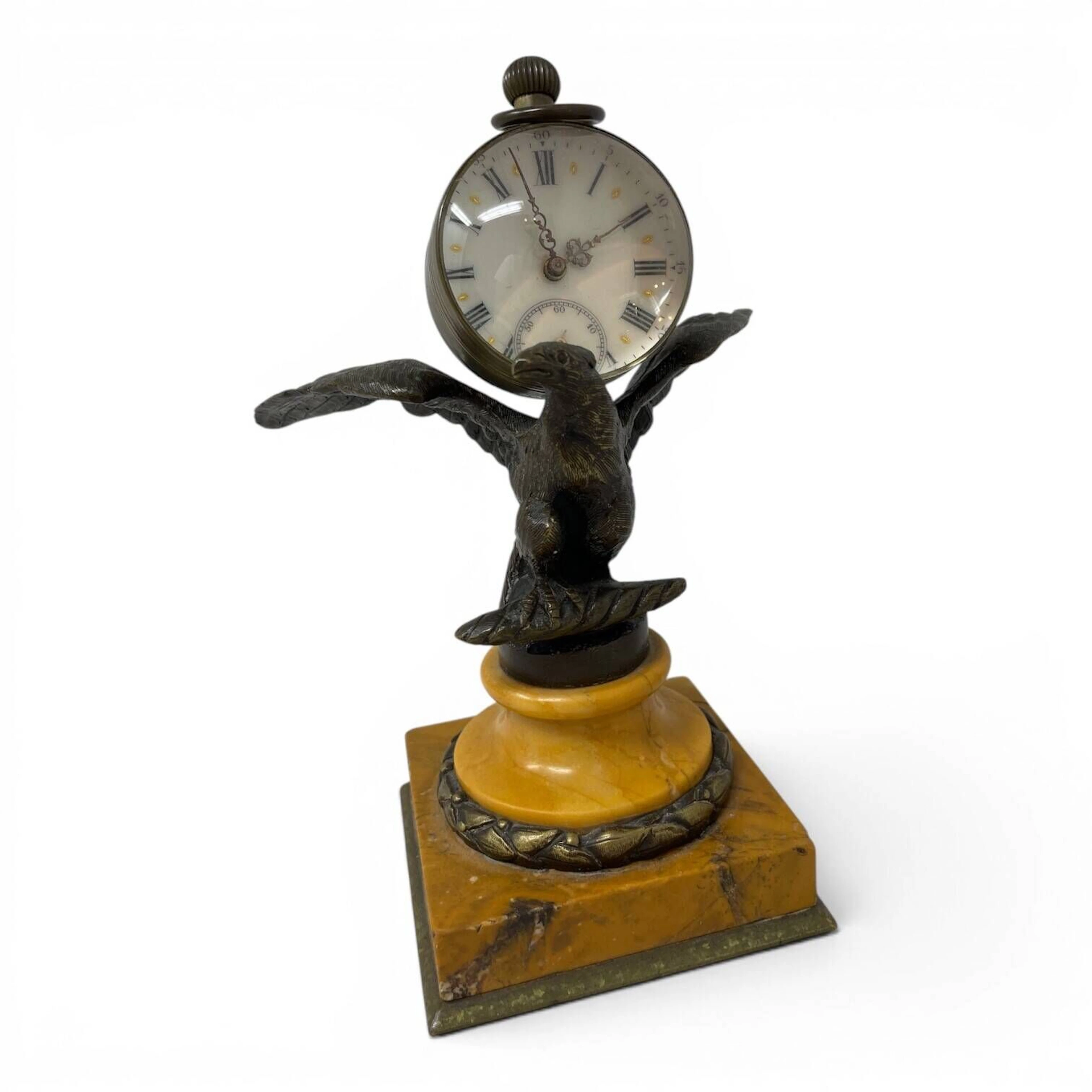 A desk clock designed in the style of a pocket watch, featur - Lot 353