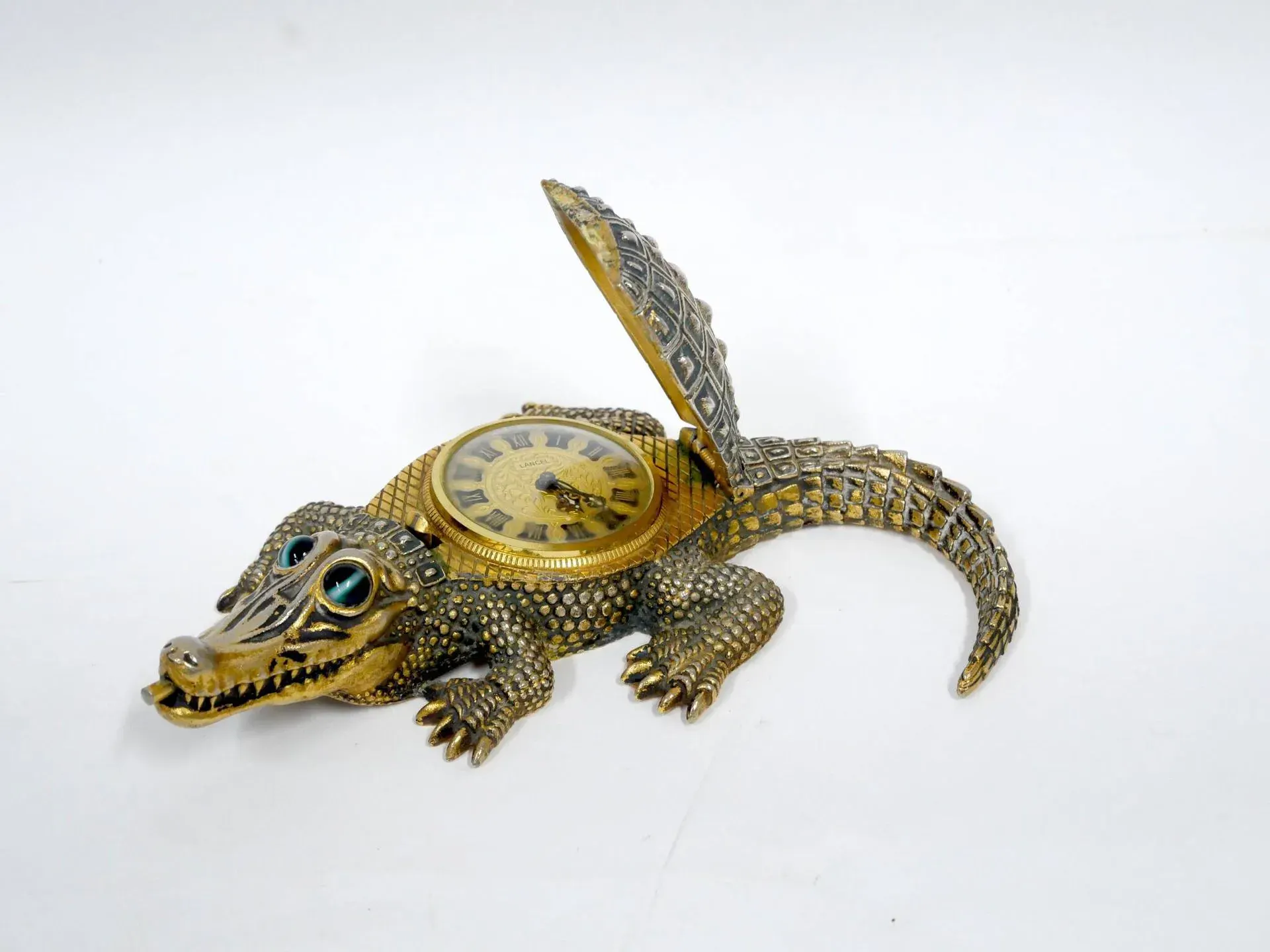 A table clock featuring a crocodile made of patinated metal, - Lot 1