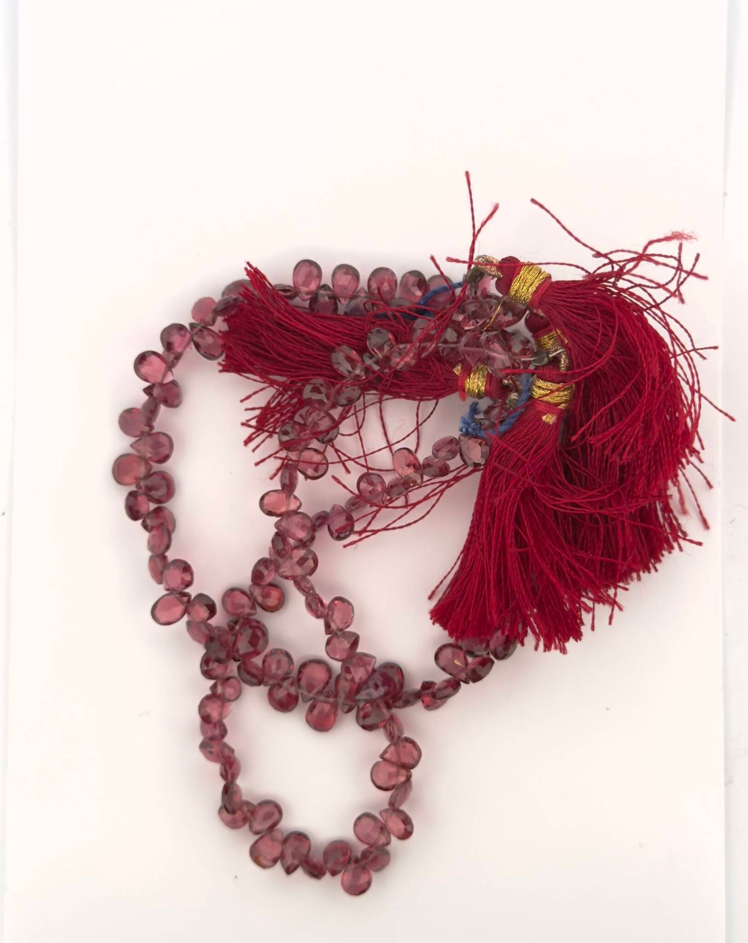 Two strands of rhodolite garnet briolettes. Weight: 92 cts. - Lot 82