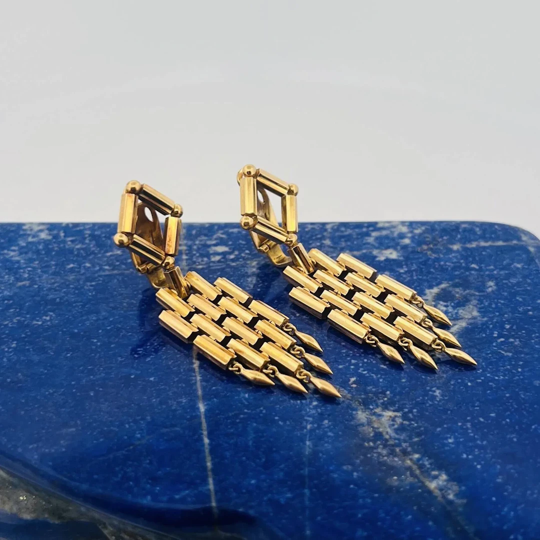 Pair of "geometric" yellow gold (750) hinged ear clips, feat - Lot 260