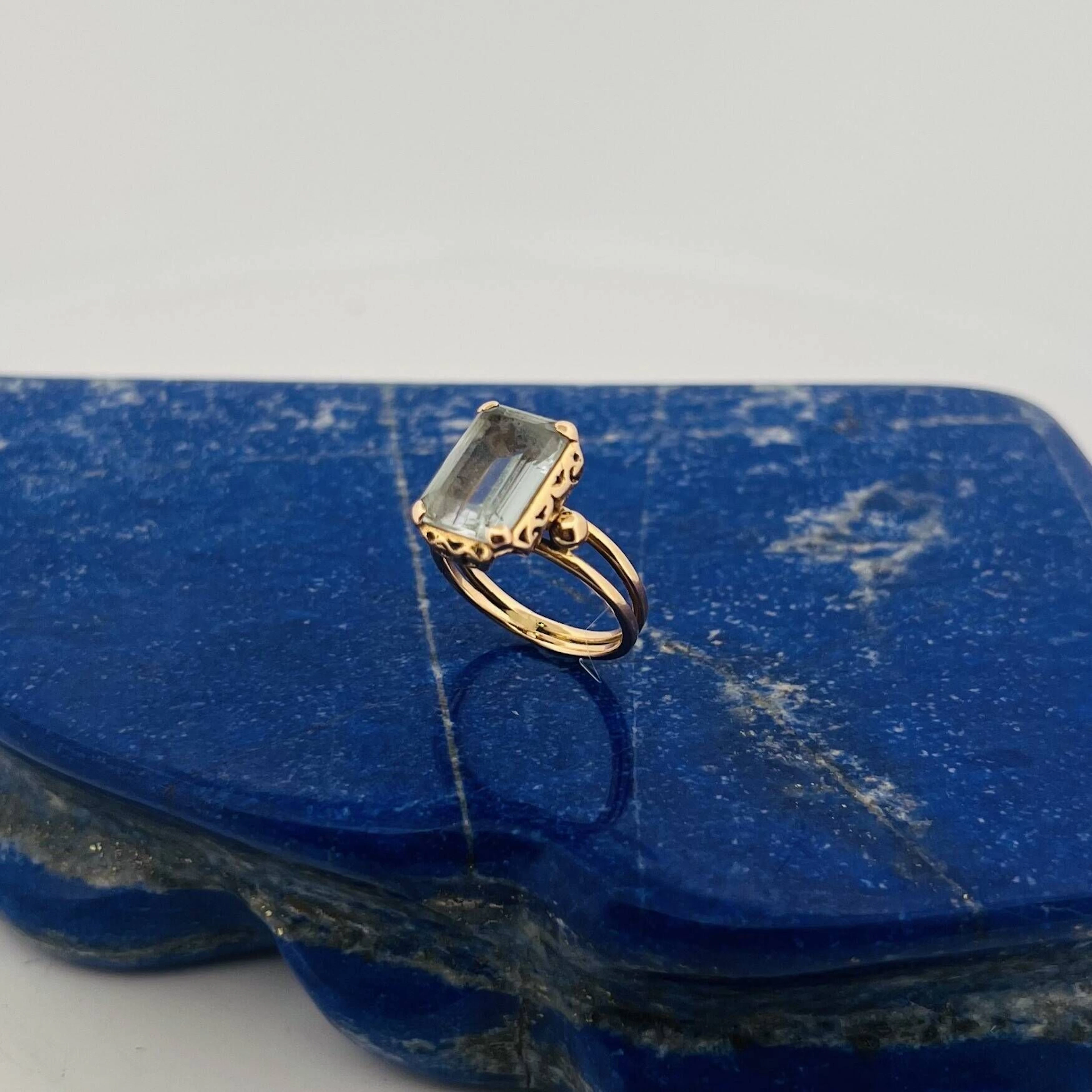 Openwork, beaded rose gold (750) ring, set with a step-cut a - Lot 56