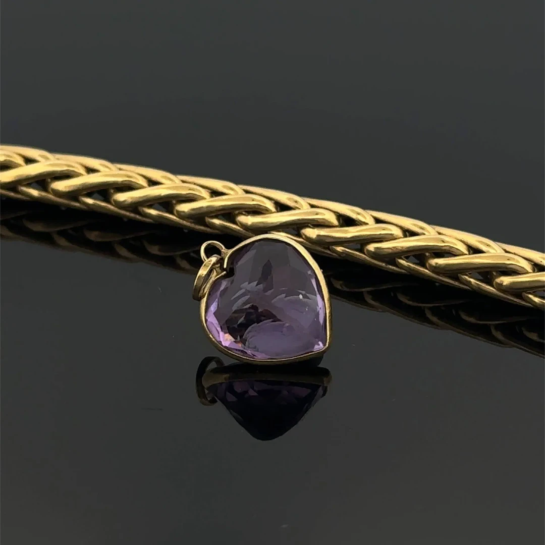 Set in yellow gold (750) consisting of: - a palm-leaf link b - Lot 253