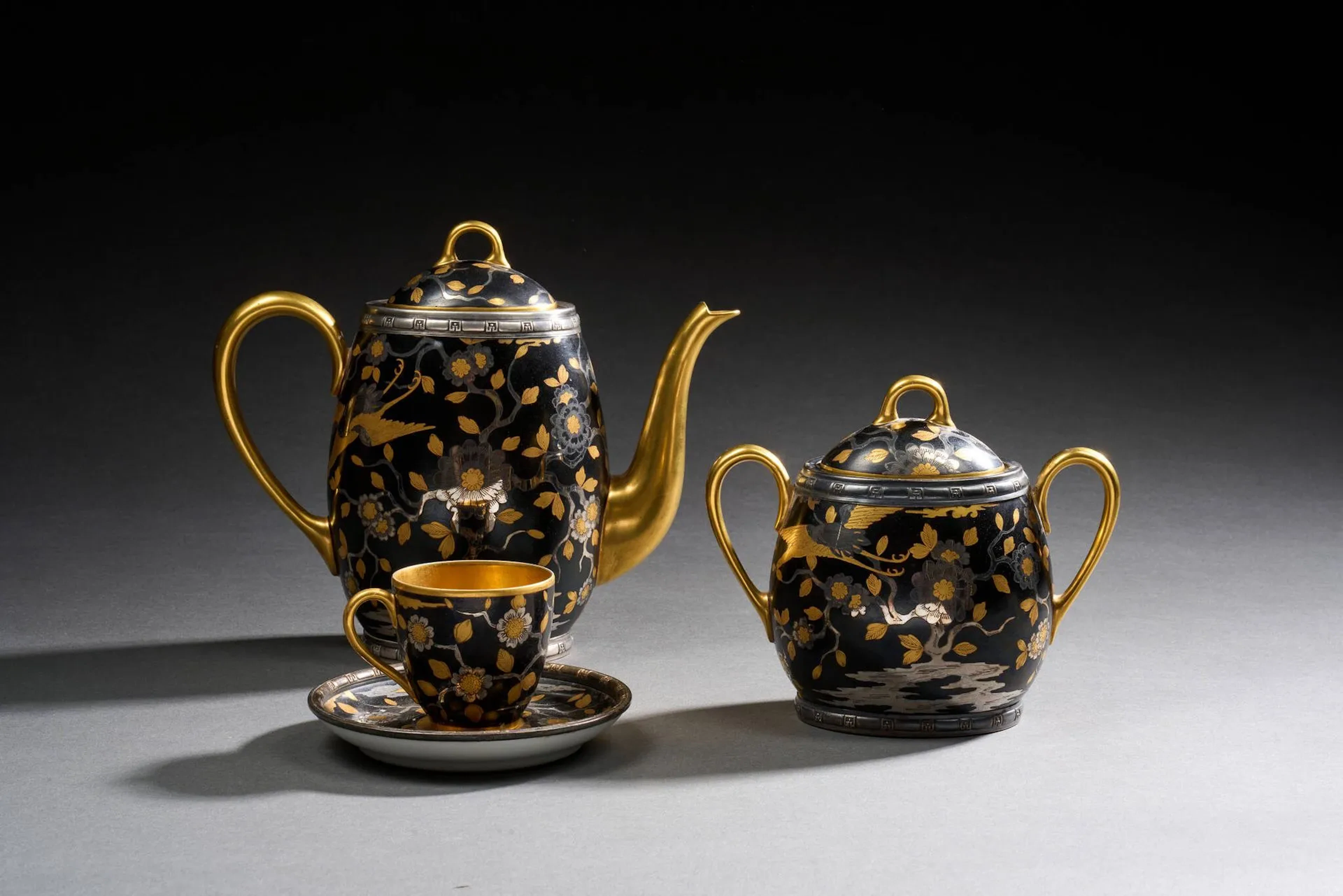 A solitary cabaret comprising a covered teapot, a covered su - Lot 197