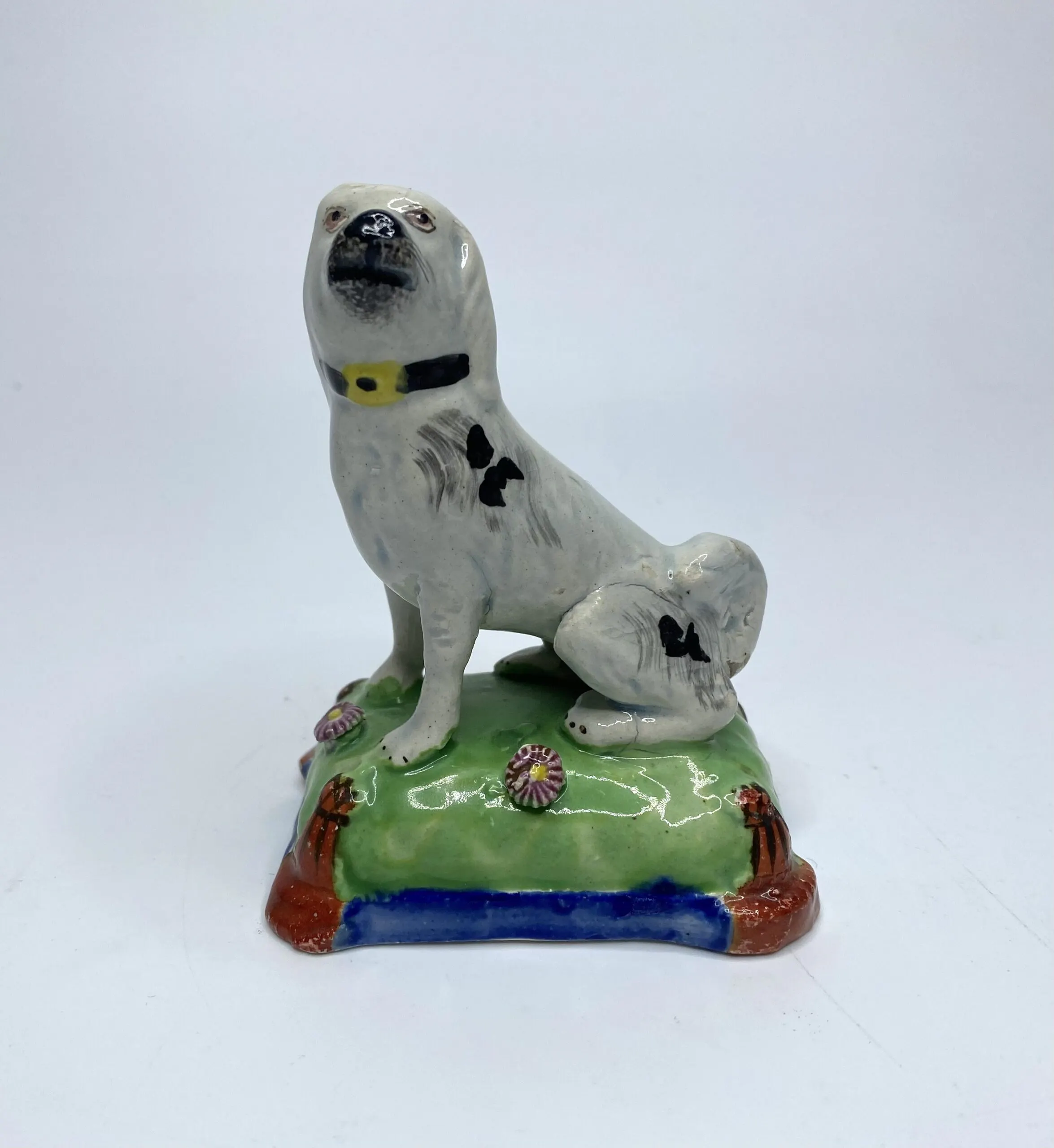 Staffordshire pottery seated dog, c. 1830.