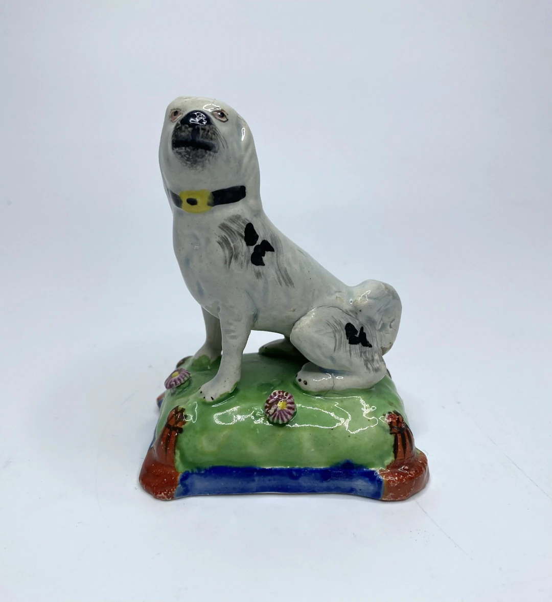 Staffordshire pottery seated dog, c. 1830.
