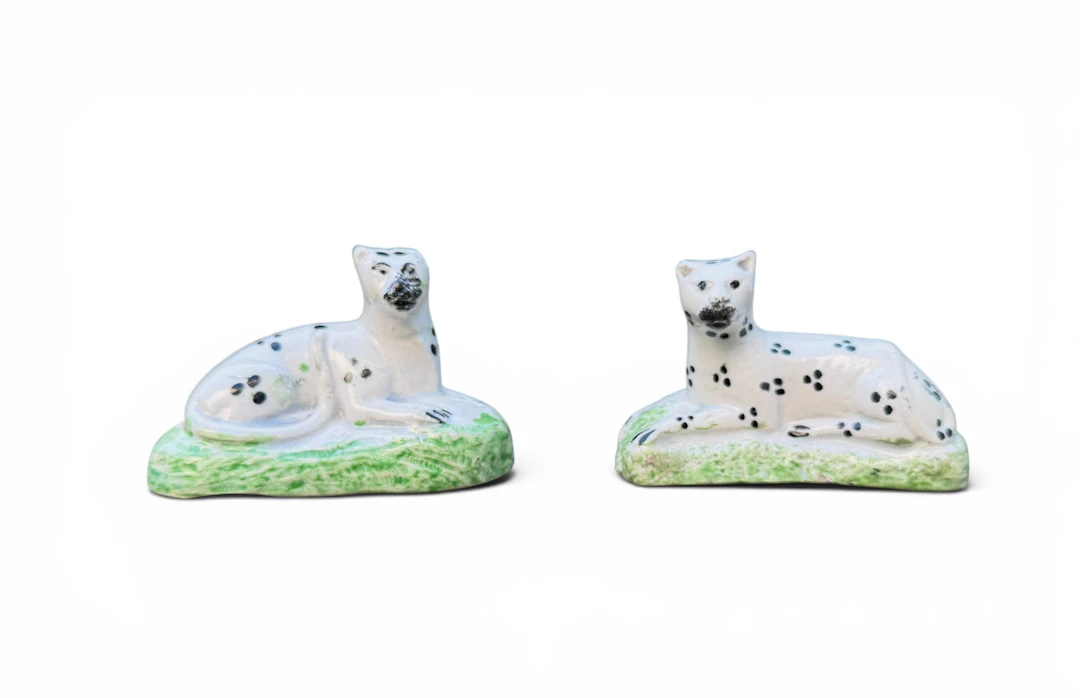 Pair of Staffordshire pottery Snow Leopards, c. 1820.