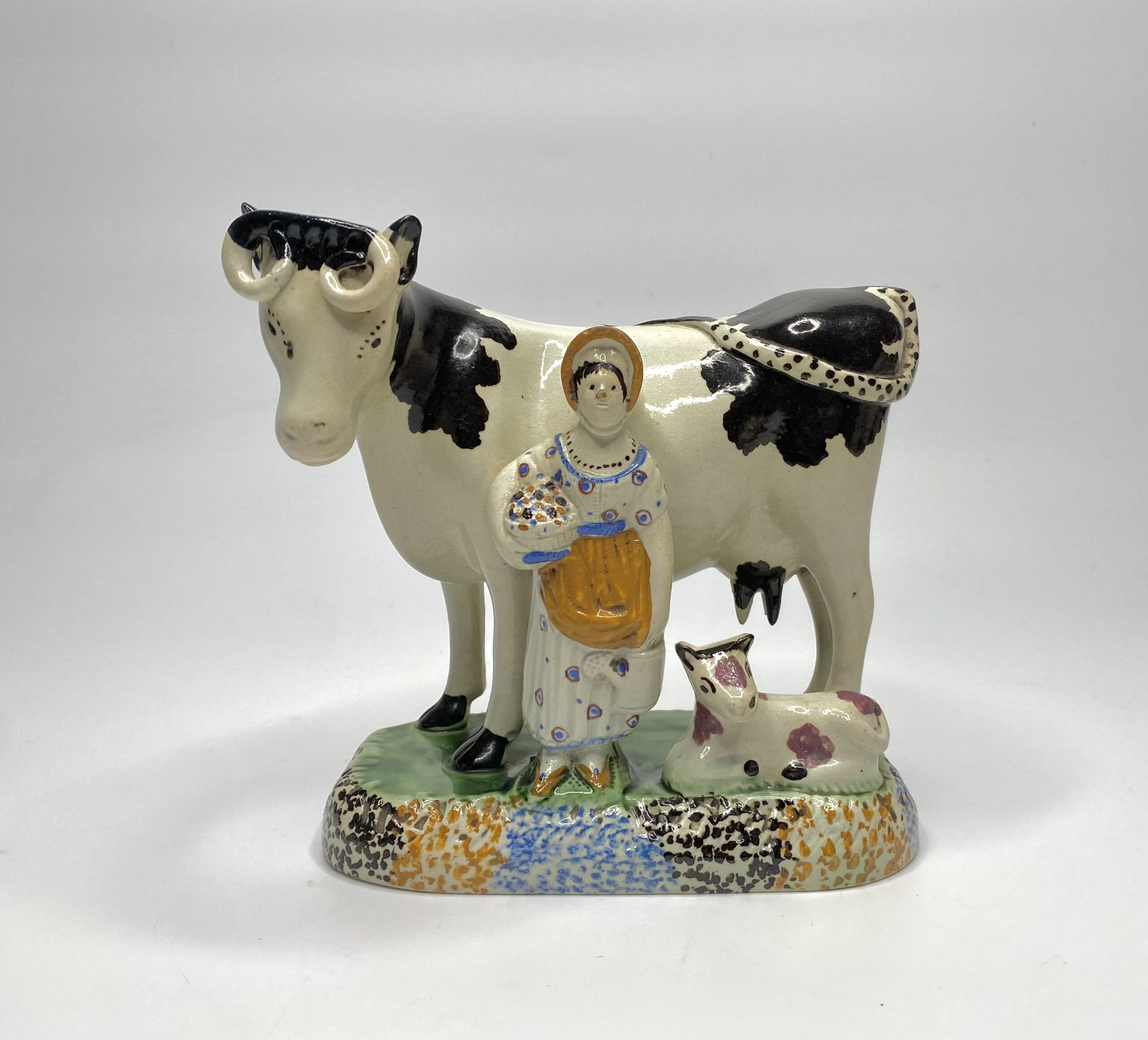 Prattware cow and maid group, Mexborough, c. 1820.