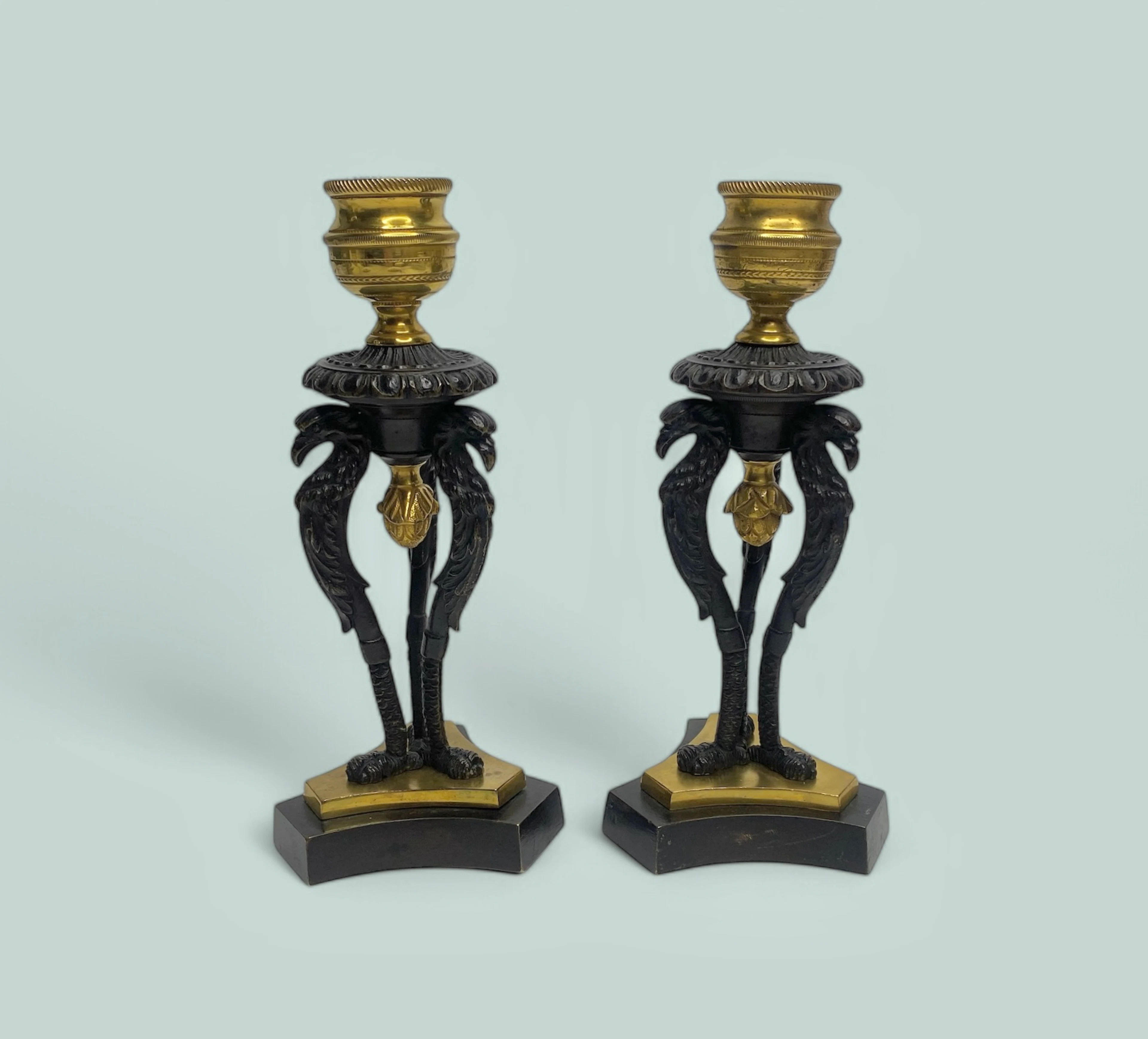 Pair Regency ormolu Griffin candlesticks, c. 1820.