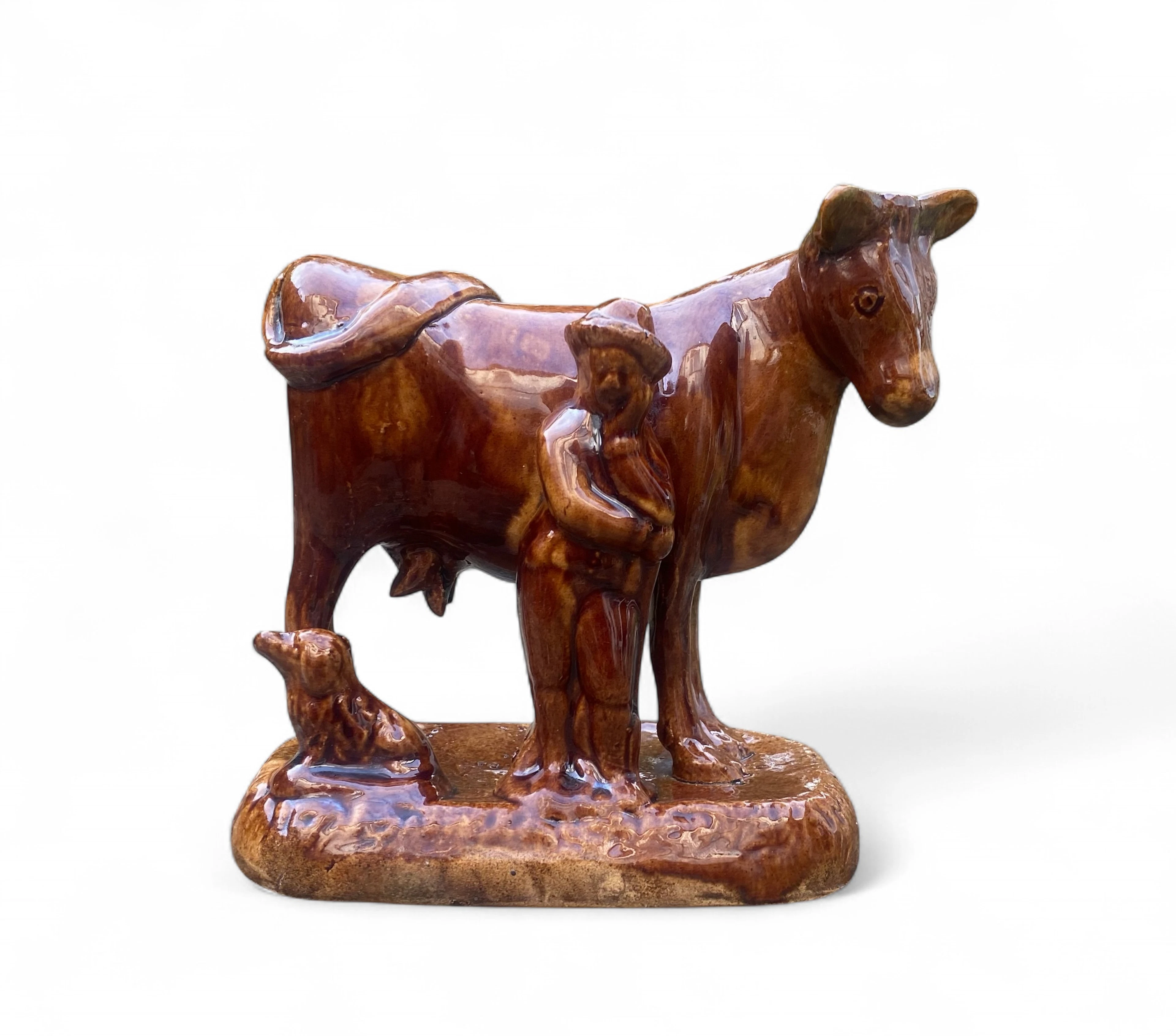 Yorkshire Potteries treacle glaze Cow group, c. 1830.