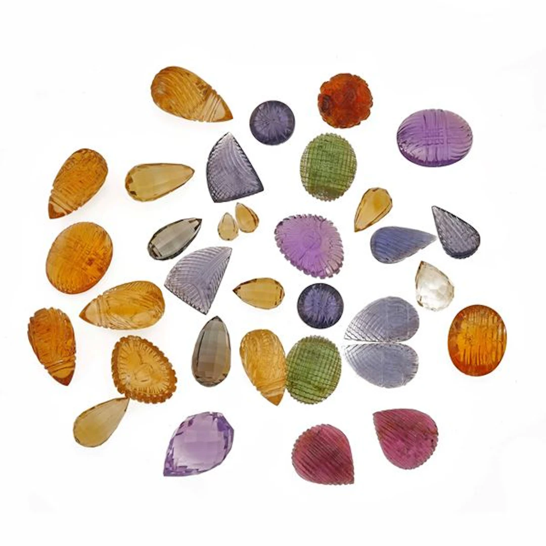 Collection of unmounted carved quartz, of various shapes, with a total