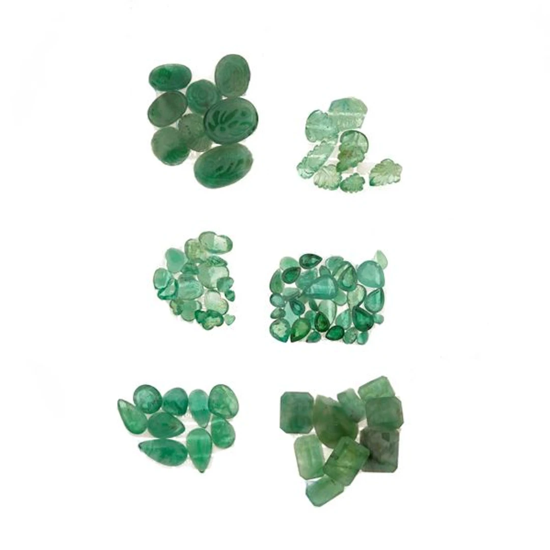 Collection of unmounted emeralds, of various shapes and treatments