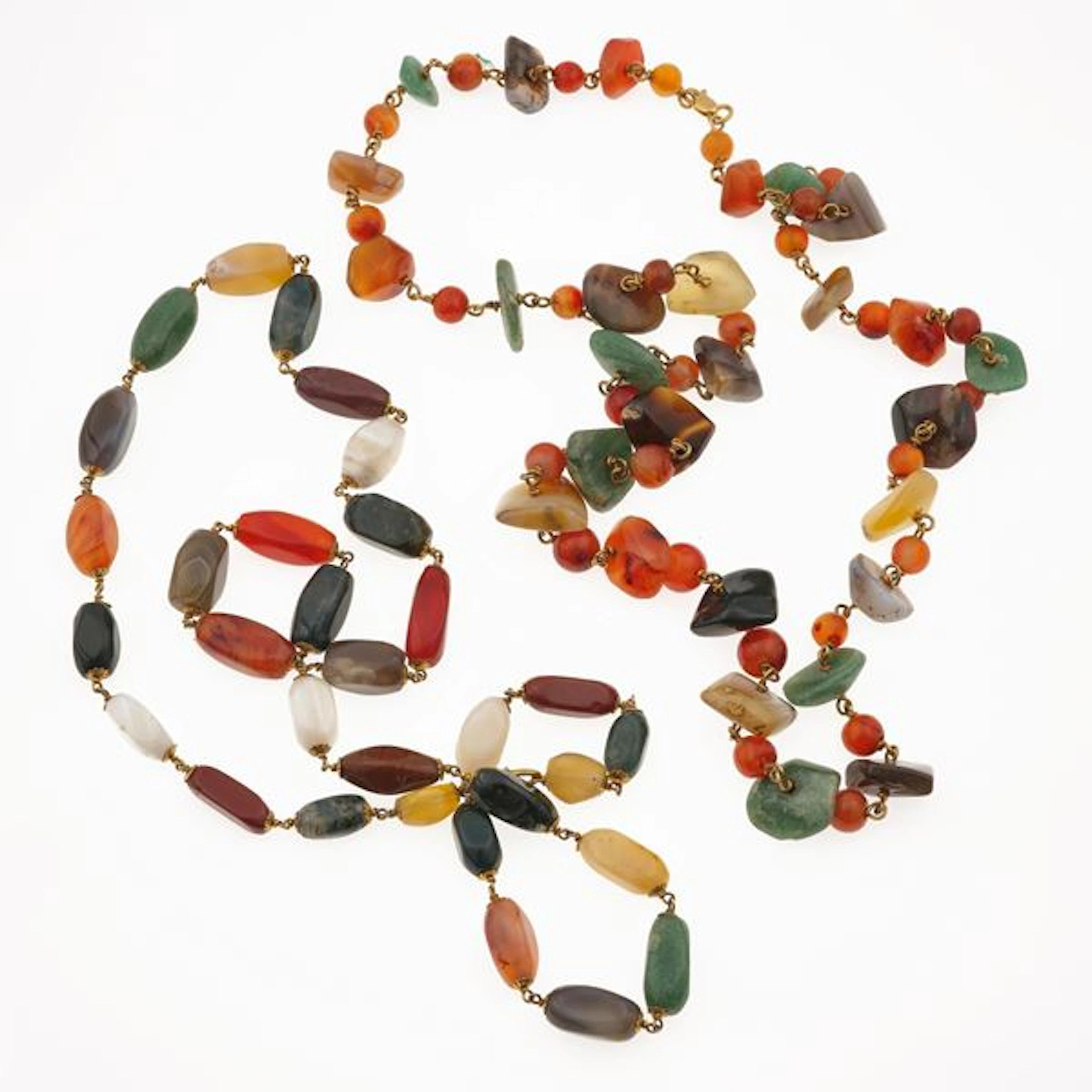 Two gemstones and gold necklace