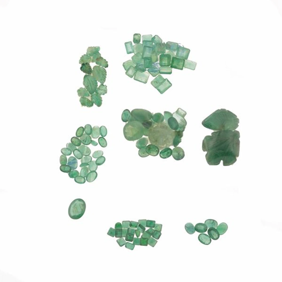 Collection of unmounted emeralds, of various shapes and treatments