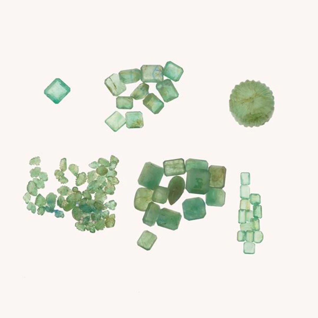 Collection of unmounted emeralds, of various shapes and treatments