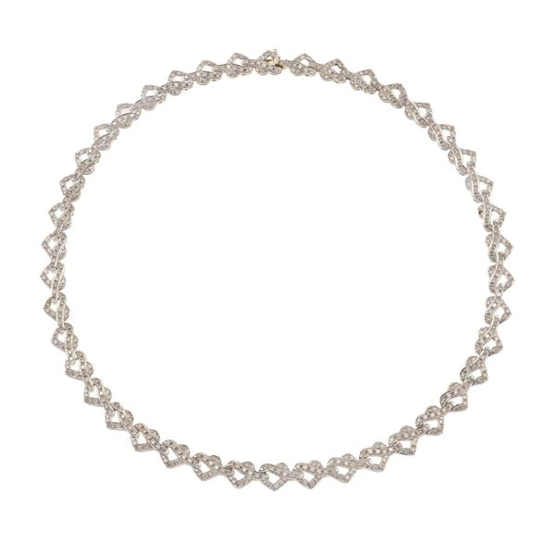 Diamond and gold "heart" necklace. One missing diamond